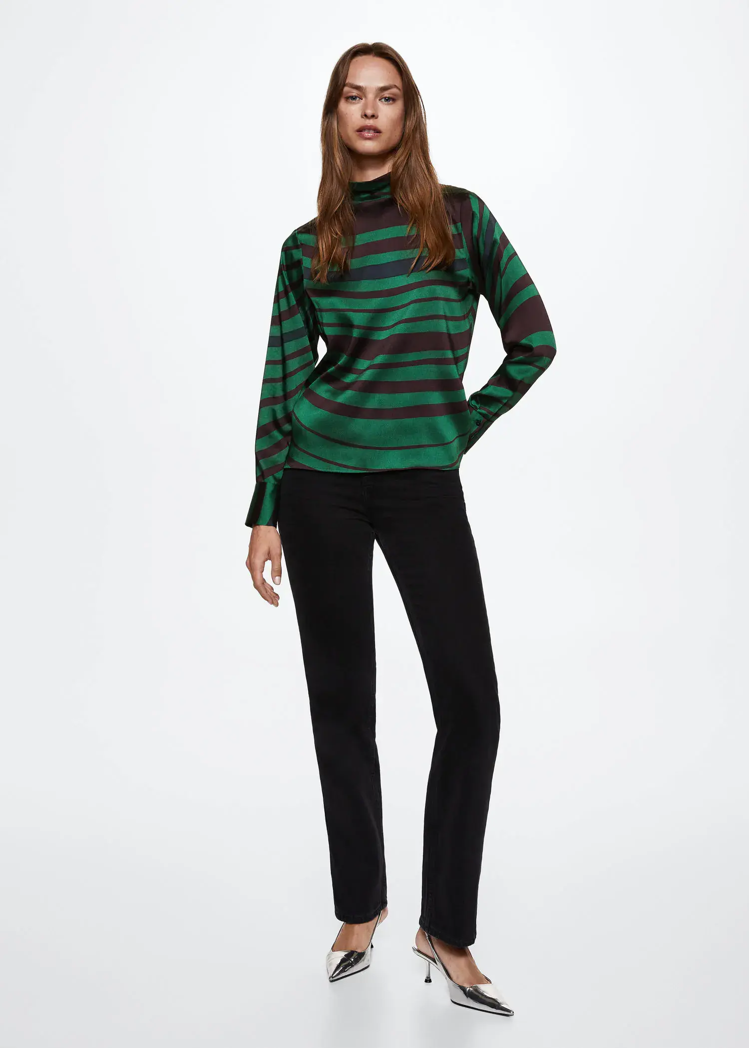 Mango High collar satin blouse. a woman wearing a green and black striped shirt and black pants. 