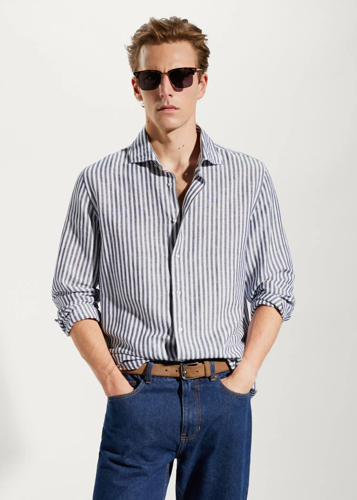 Mango Slim fit striped linen shirt. a man wearing sunglasses and a striped shirt. 