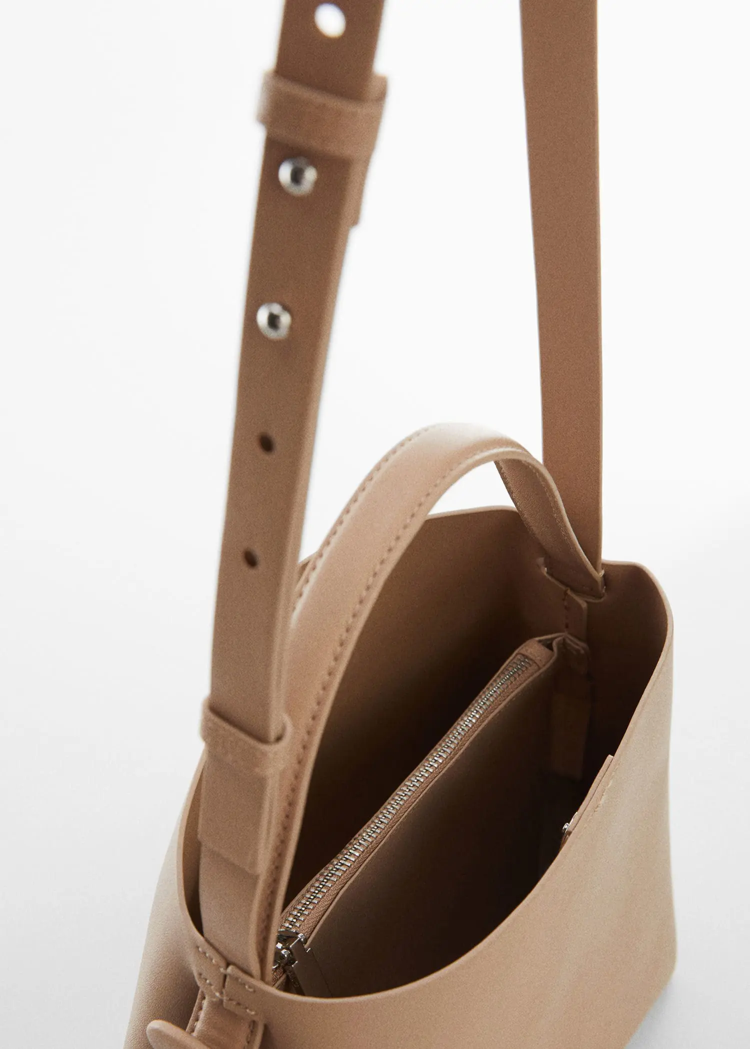 Mango Shopper bag with buckle. a close-up view of the inside of a purse. 