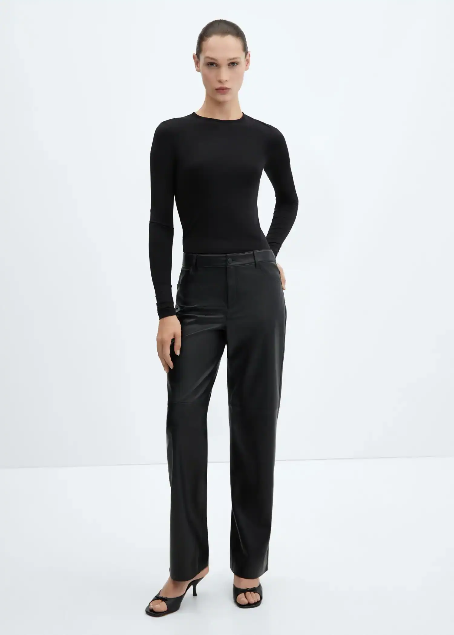 Mango Mid-rise leather effect trousers. 1