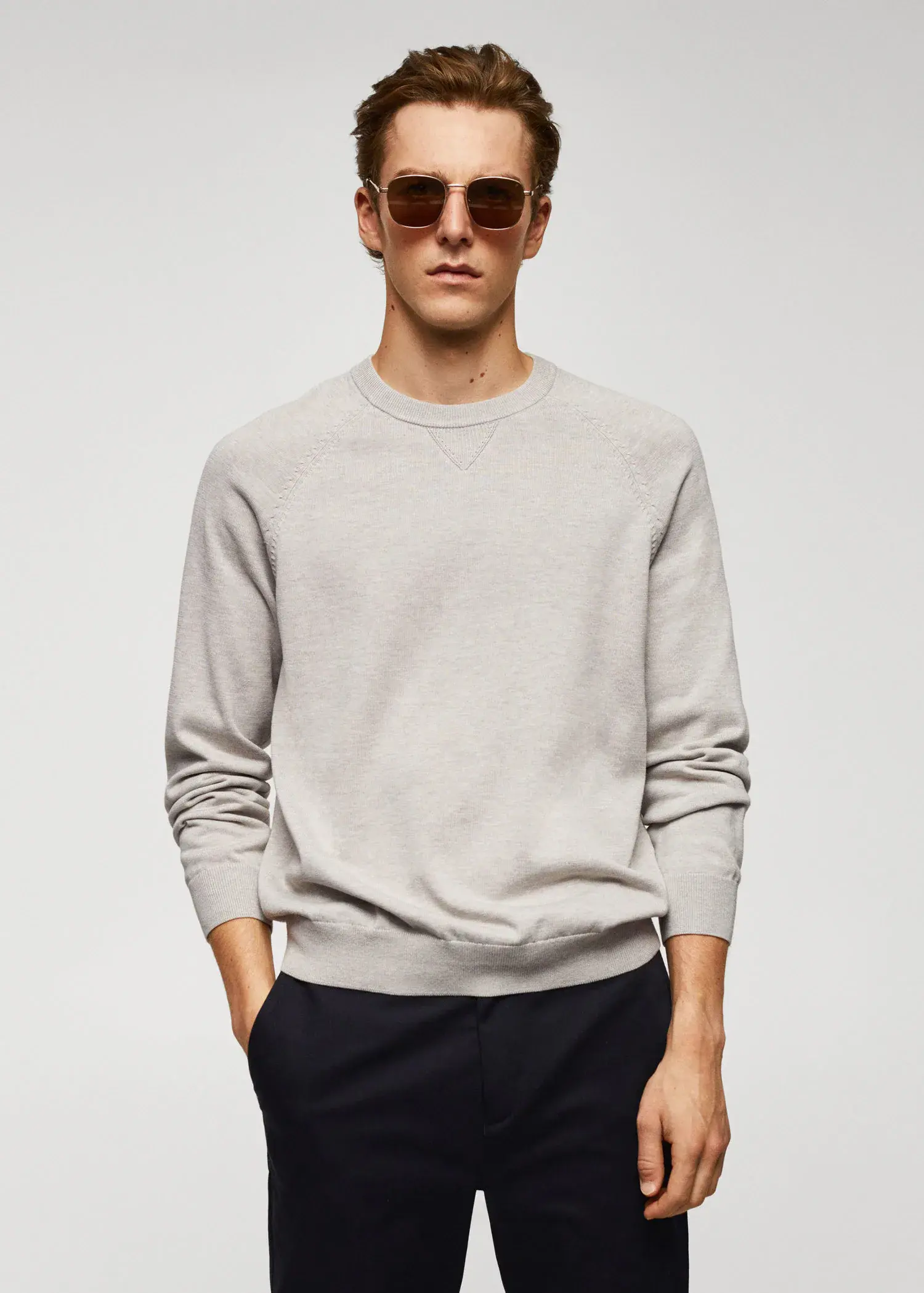 Mango Fine-knit cotton sweater. a man wearing sunglasses standing in front of a white wall. 