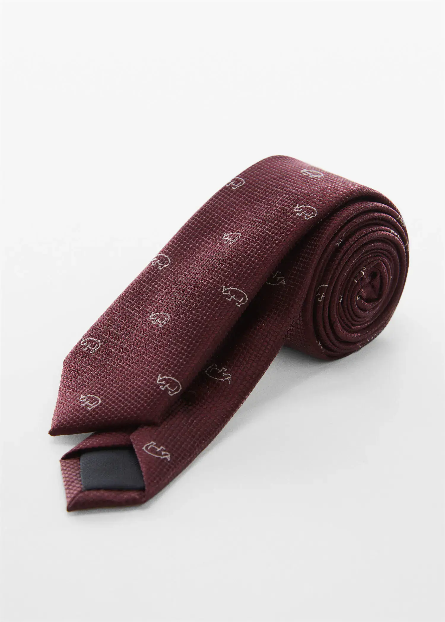 Mango Tie with animals print . a red tie is laying on a table. 