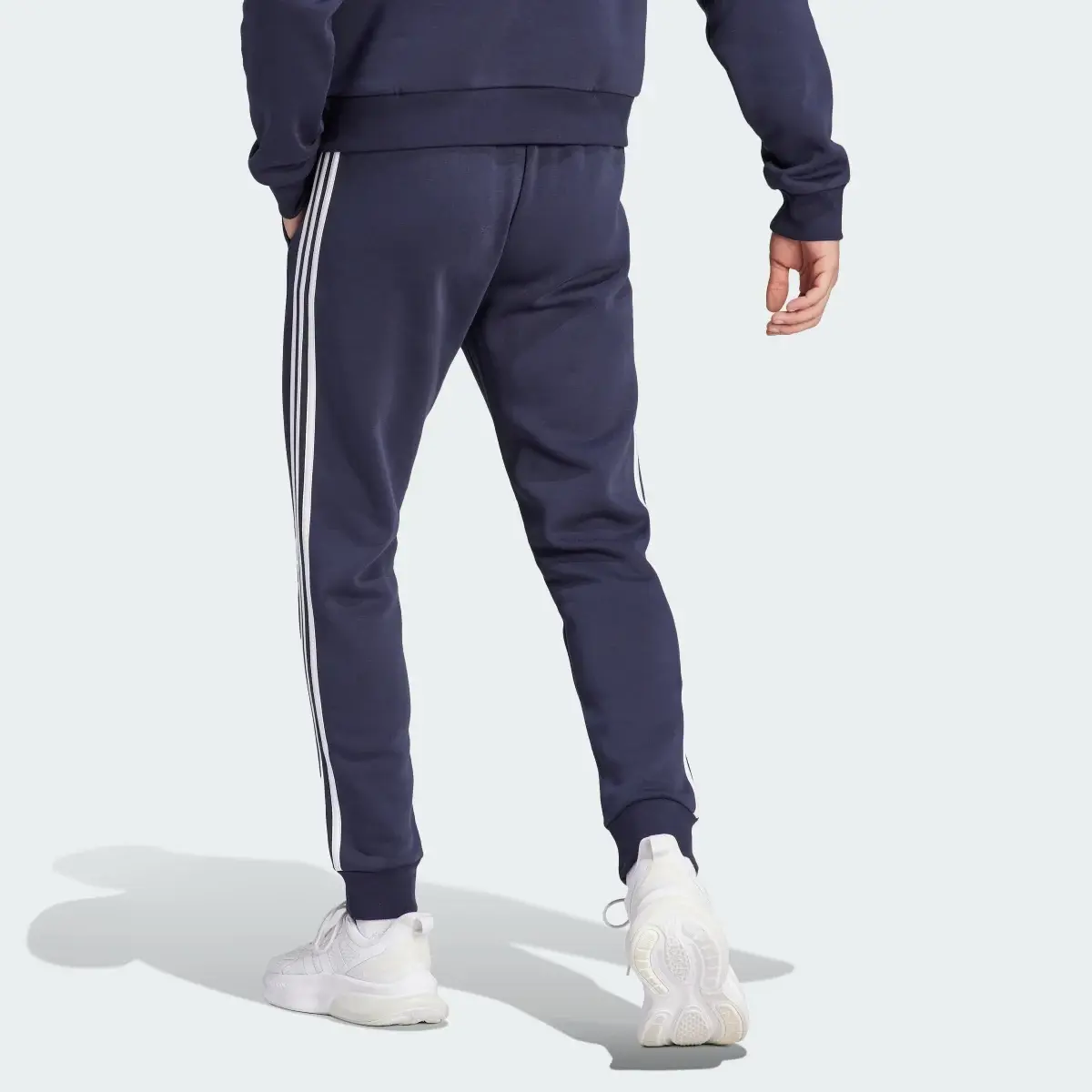 Adidas Spodnie Essentials Fleece 3-Stripes Tapered Cuff. 2