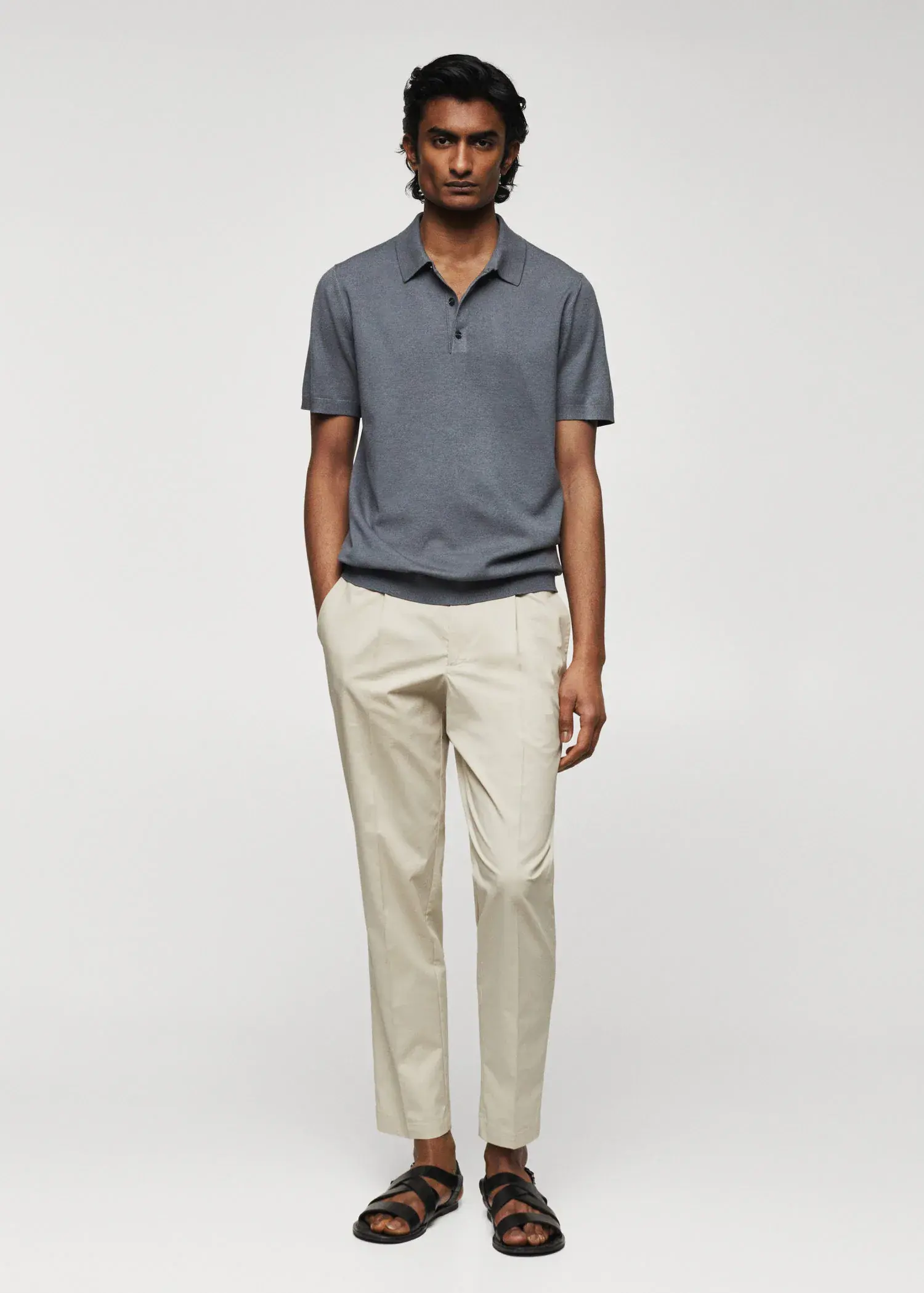 Mango Fine-knit polo shirt. a man in a gray polo shirt and beige pants. 