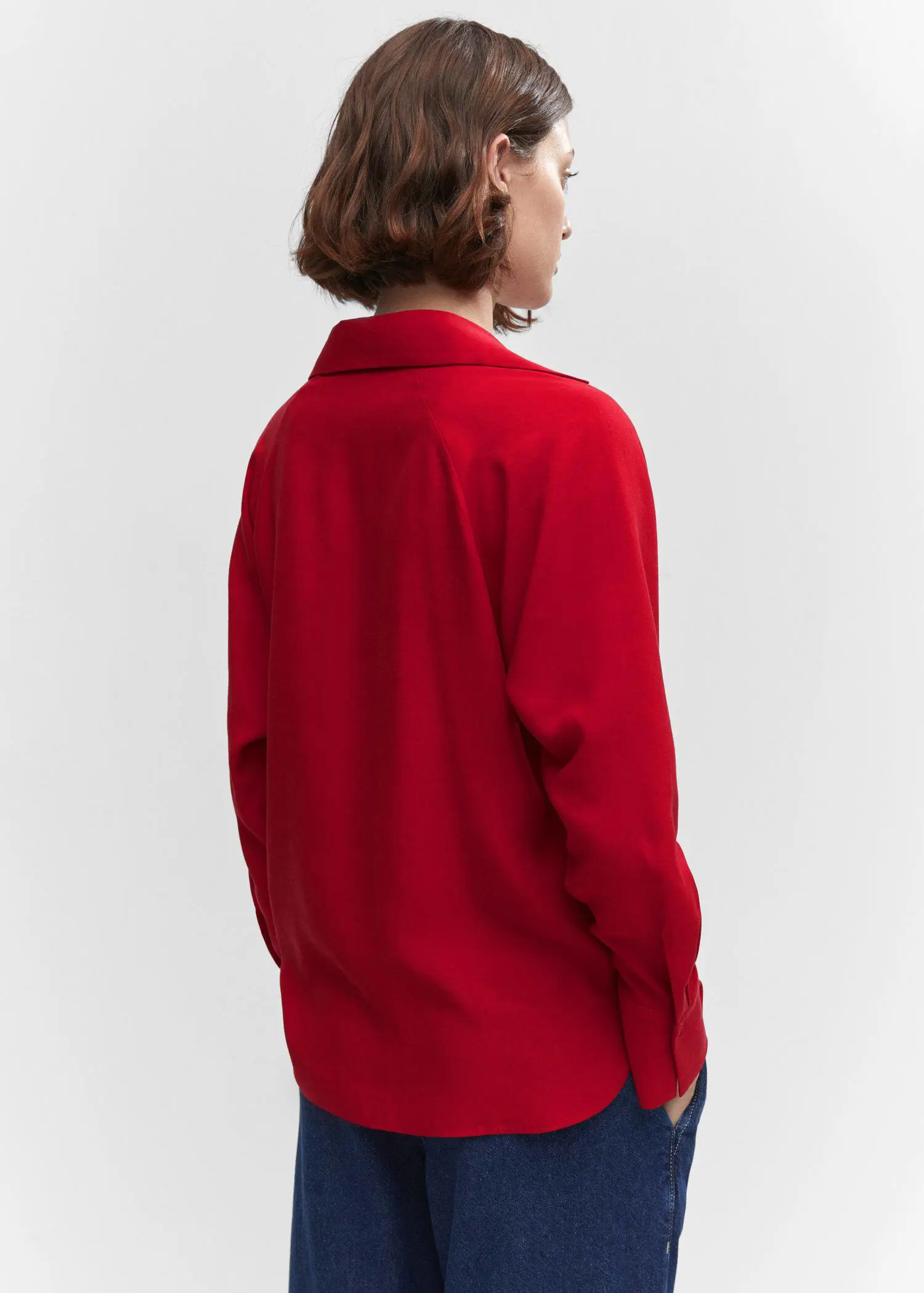 Mango Lyocell fluid shirt. a person standing in a room wearing a red shirt. 