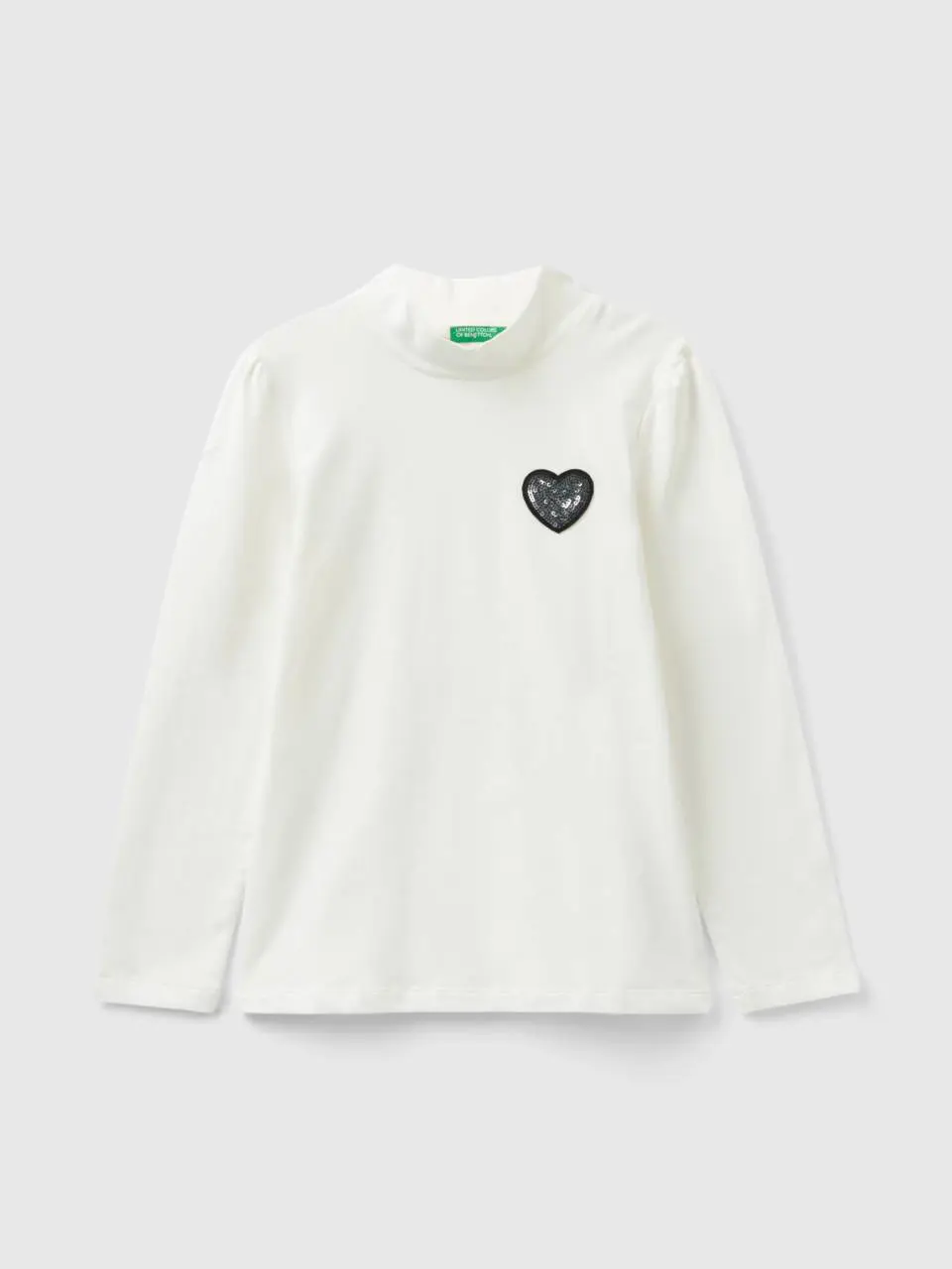 Benetton turtle neck t-shirt con sequined patch. 1