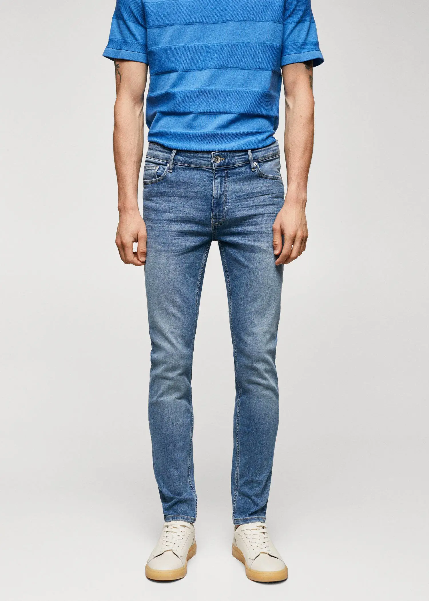 Mango Jude skinny-fit jeans. a man wearing a blue shirt and jeans. 