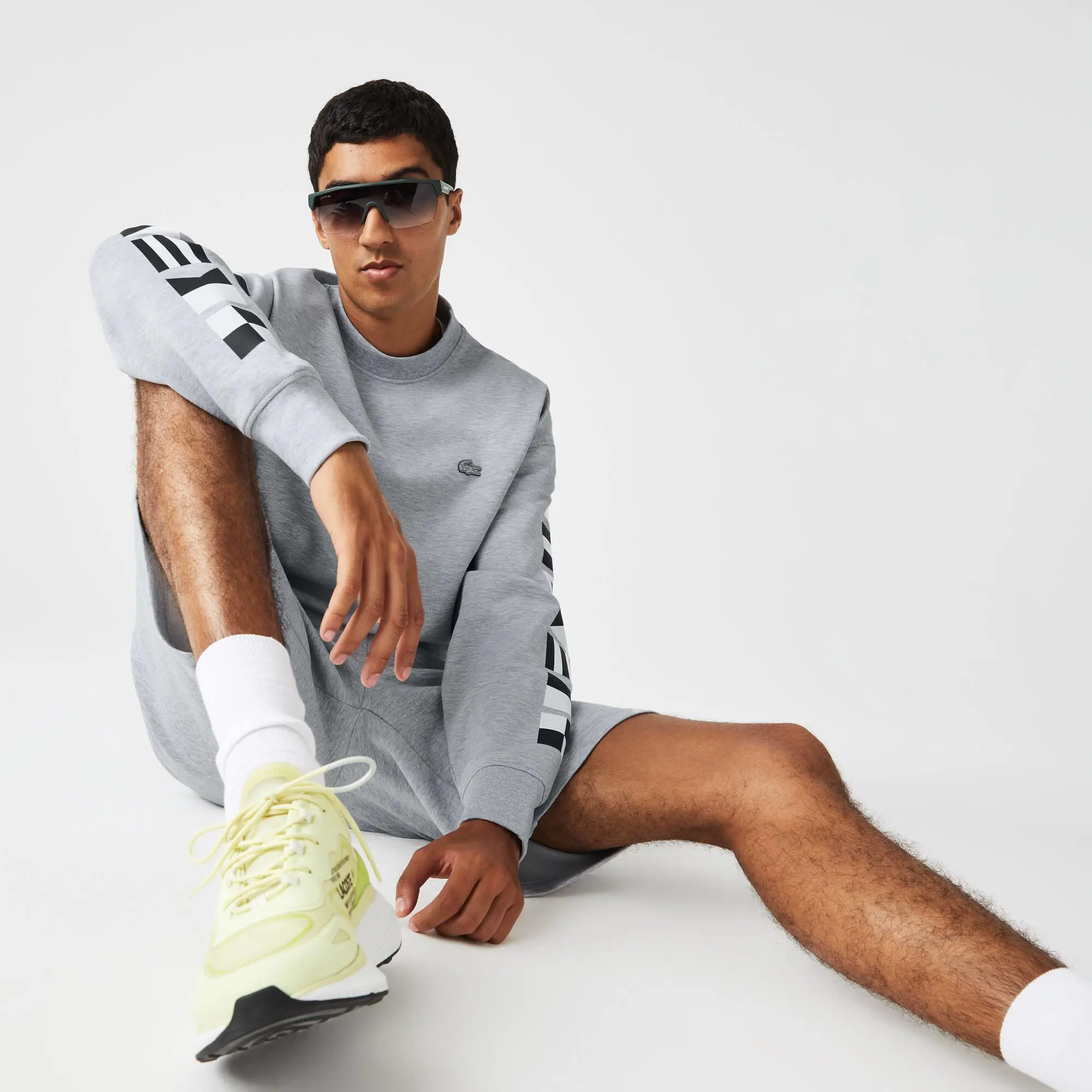 Lacoste Men's Lacoste Loose Fit Reflective Print Sweatshirt. 1 Lacoste Men's Lacoste Loose Fit Reflective Print Sweatshirt. 1
