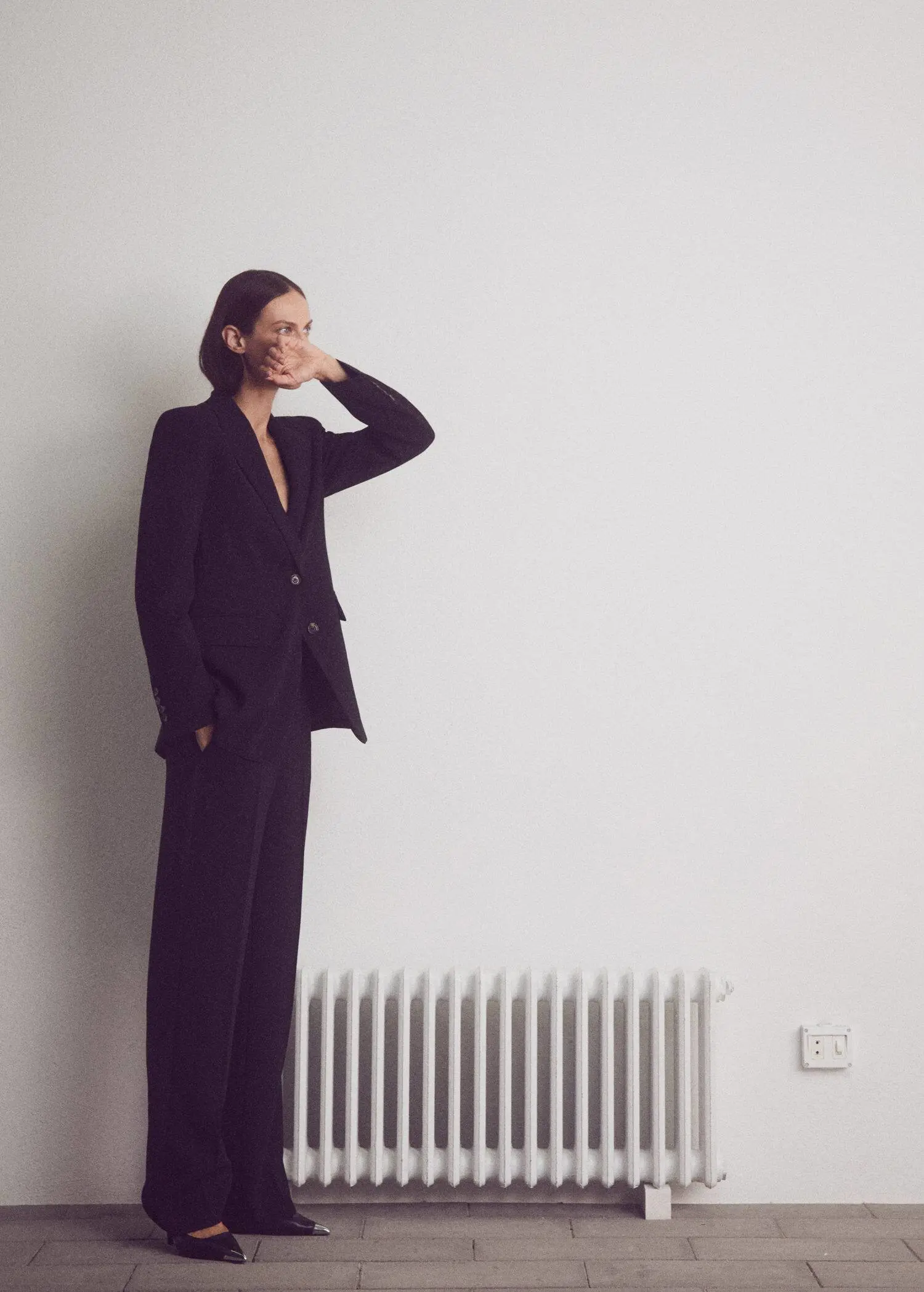 Mango Suit blazer with buttons. a woman standing in front of a radiator. 