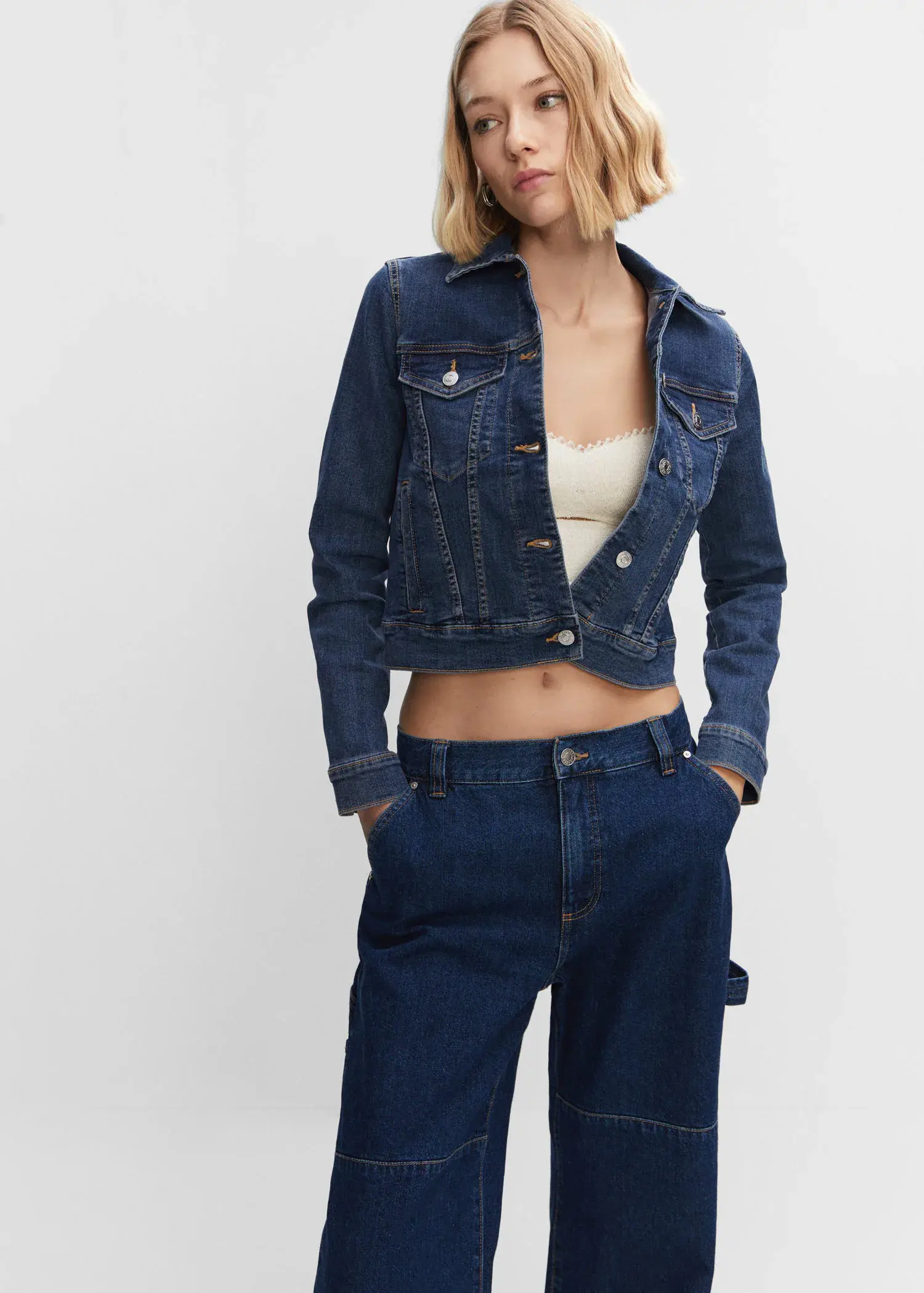 Mango Pocketed denim jacket. a woman wearing a jean jacket and jeans. 
