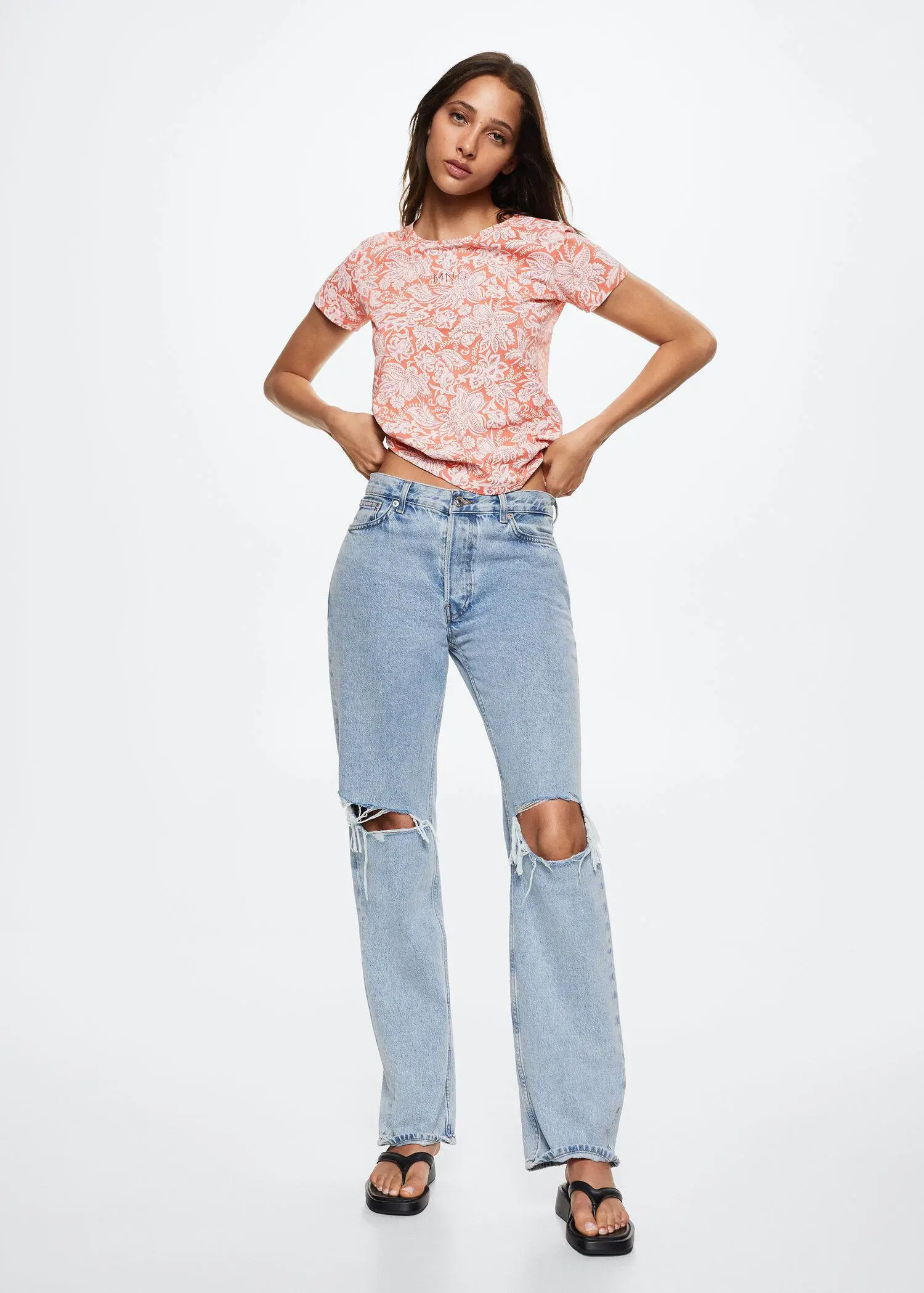Mango Printed cotton-blend T-shirt. a woman in a pink floral shirt and blue jeans. 