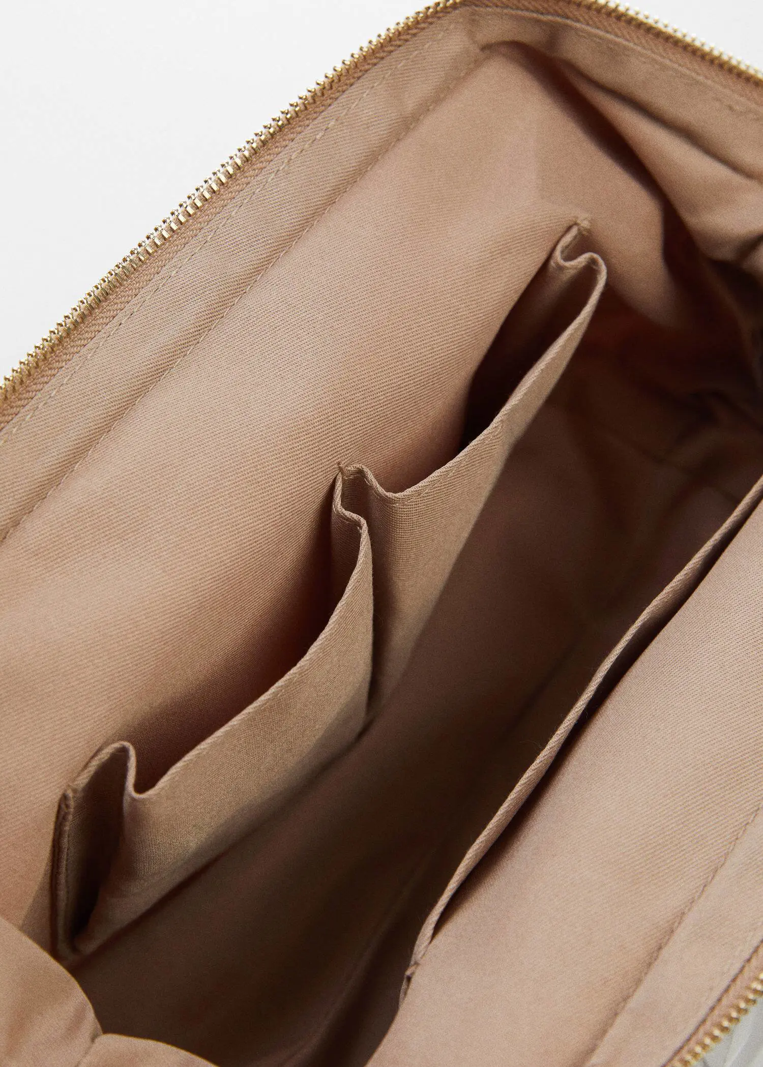 Mango Zipped nylon cosmetics bag. a close-up view of the inside of a purse. 