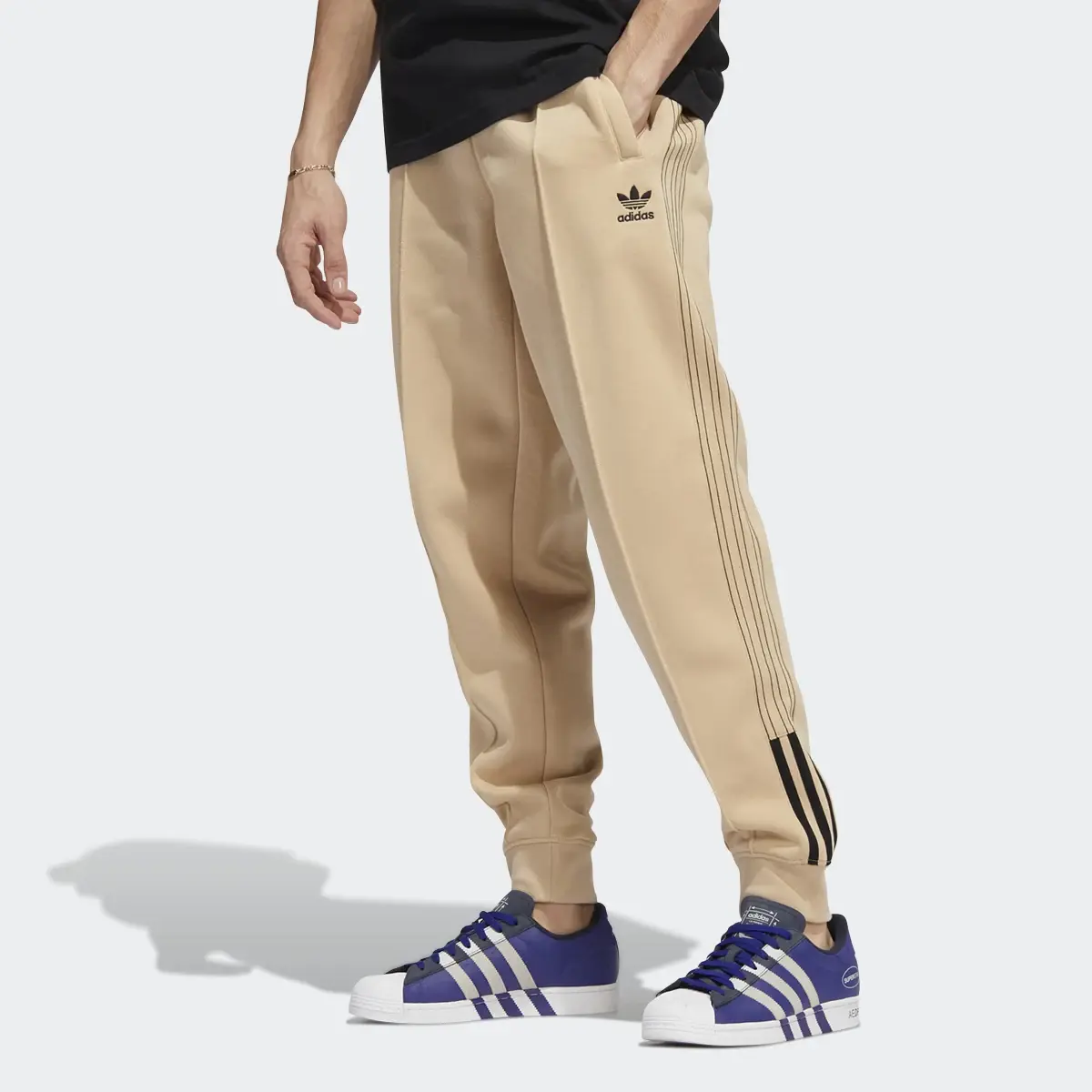 Adidas Fleece SST Track Pants. 1