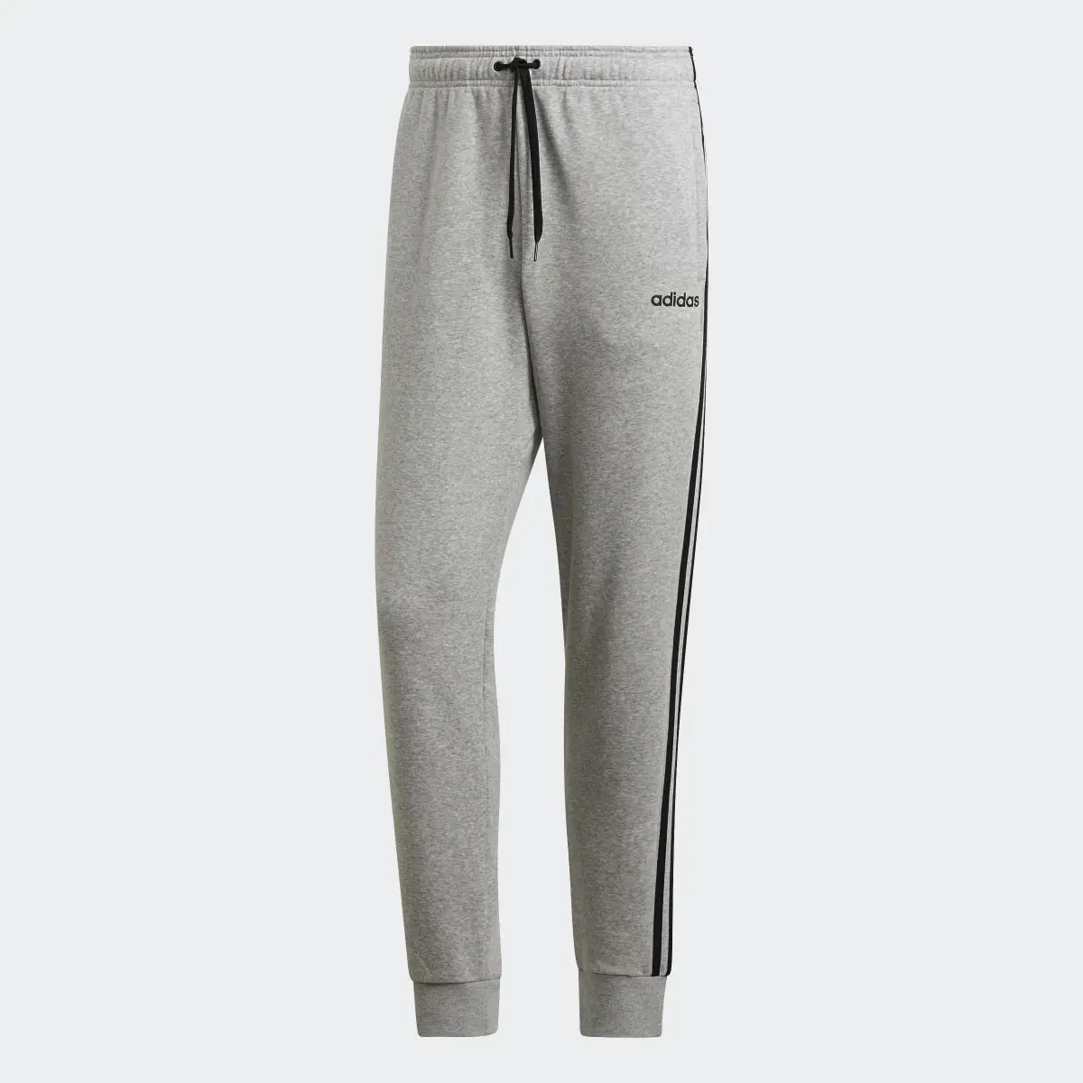 Adidas Pantalón Essentials Tapered Cuffed 3 bandas. 1