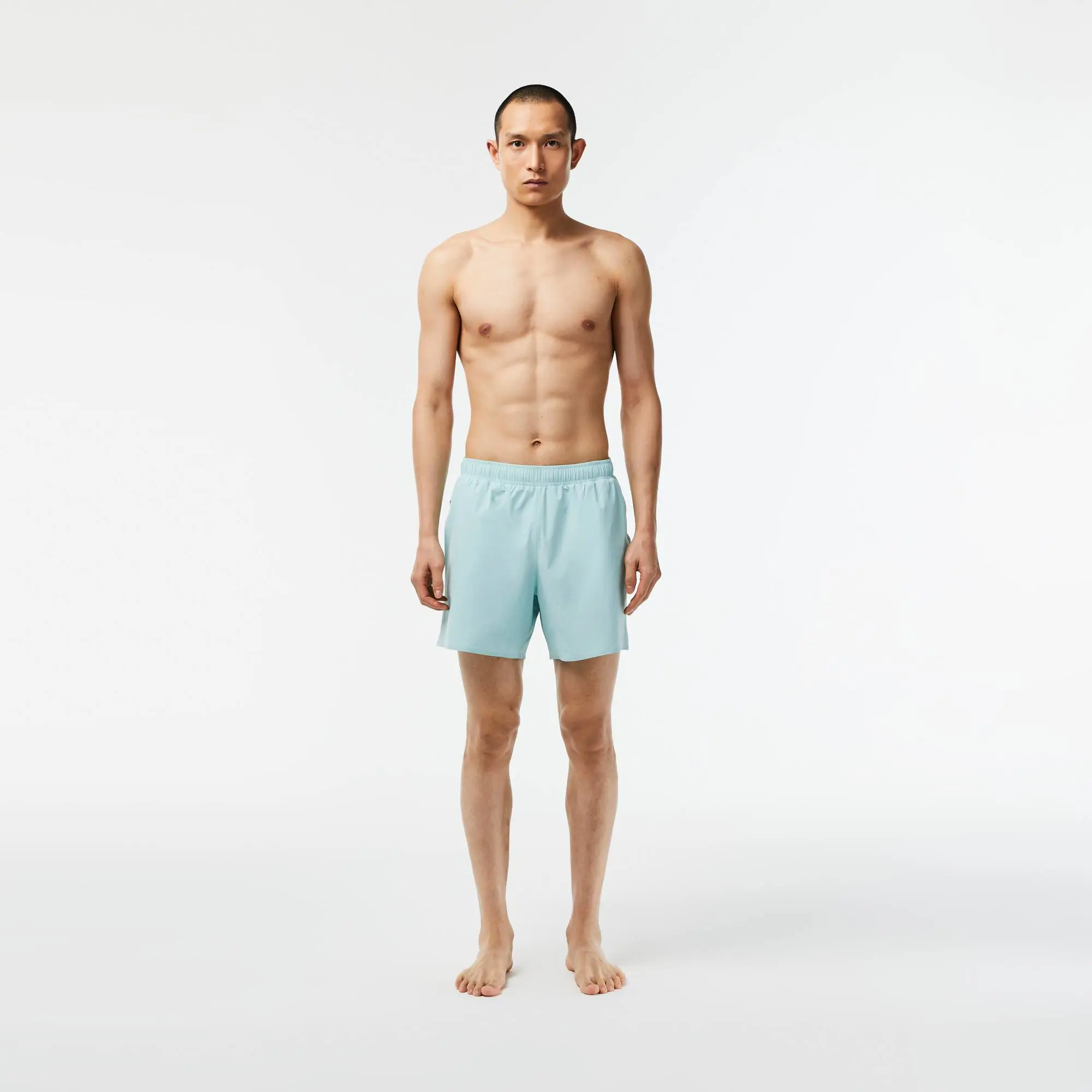 Lacoste Short de bain léger court uni avec boxer intégré. 1