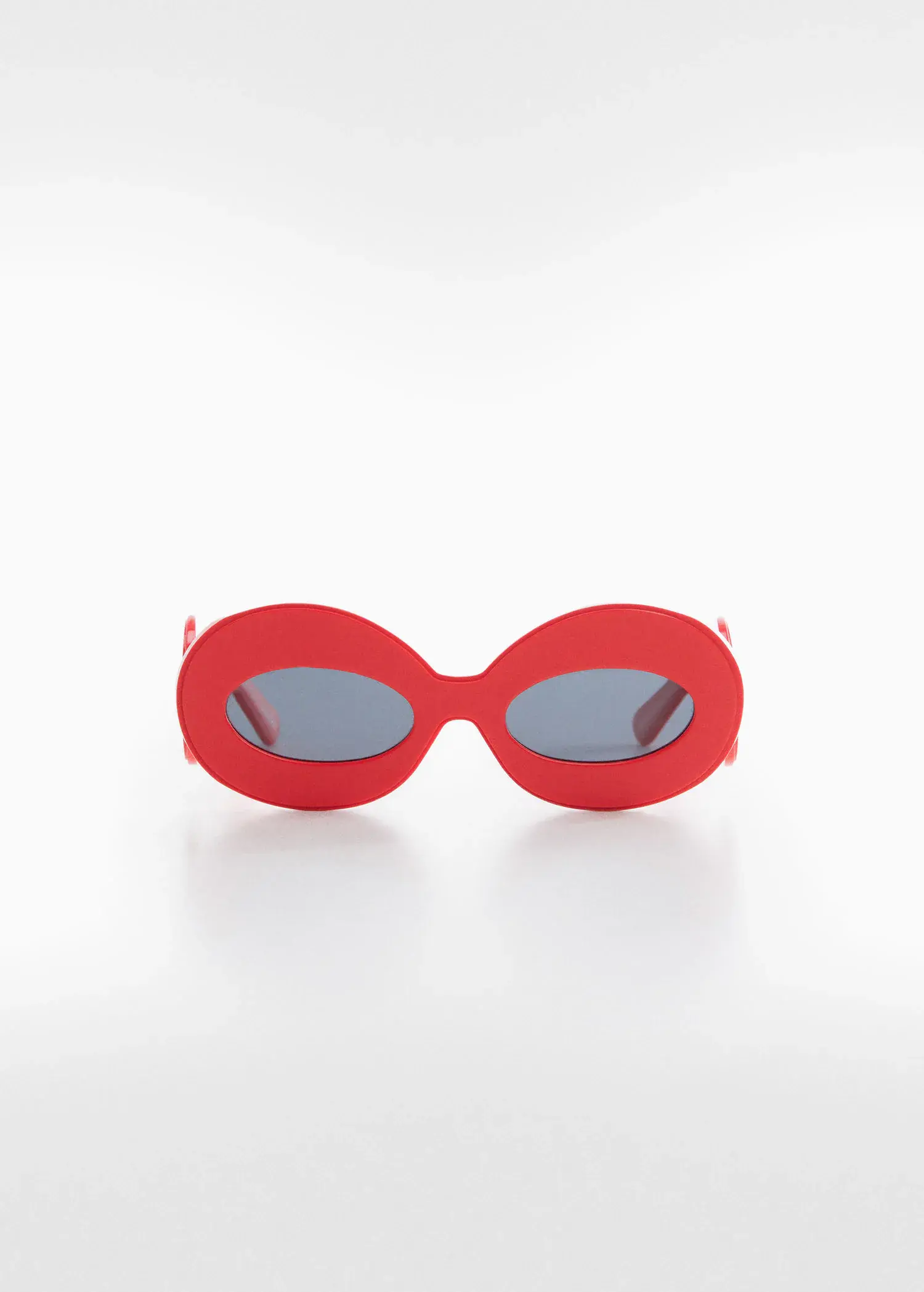 Mango Maxi-frame sunglasses. a pair of red sunglasses sitting on top of a table. 