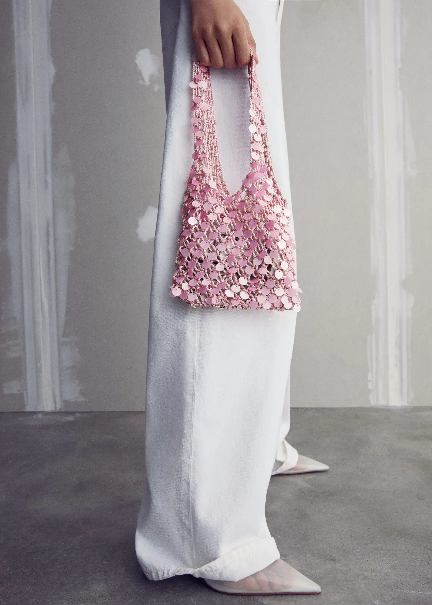Mango Sequined net bag. a white dress with a pink purse on it 