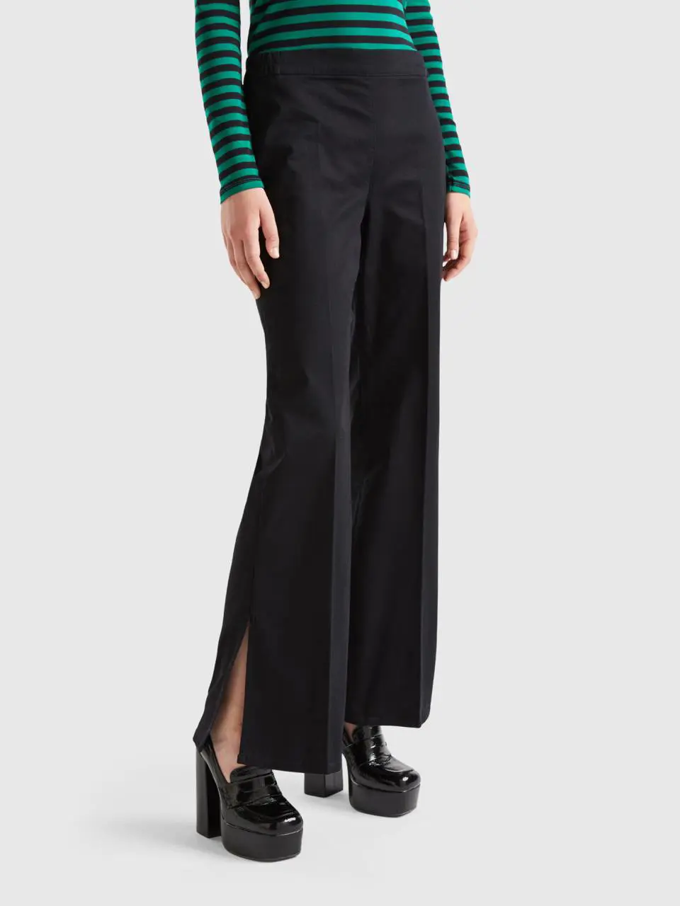 Benetton flared trousers with slits. 1