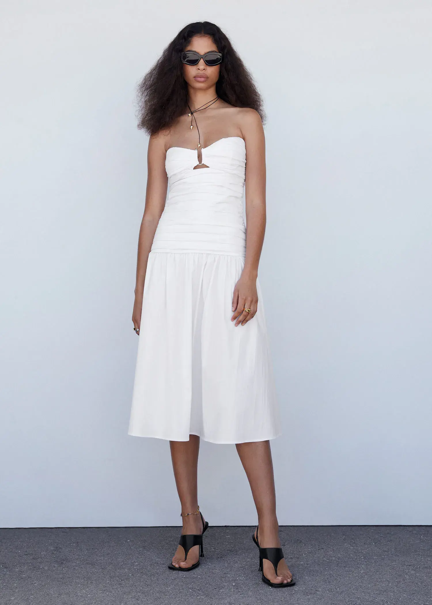 Mango Draped dress with metallic detail. a woman in a white dress posing for a picture. 