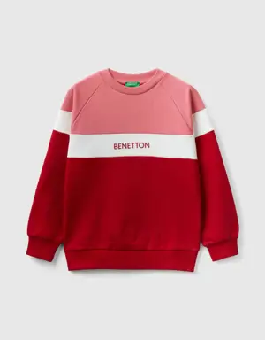 pink and red sweatshirt with embroidered logo