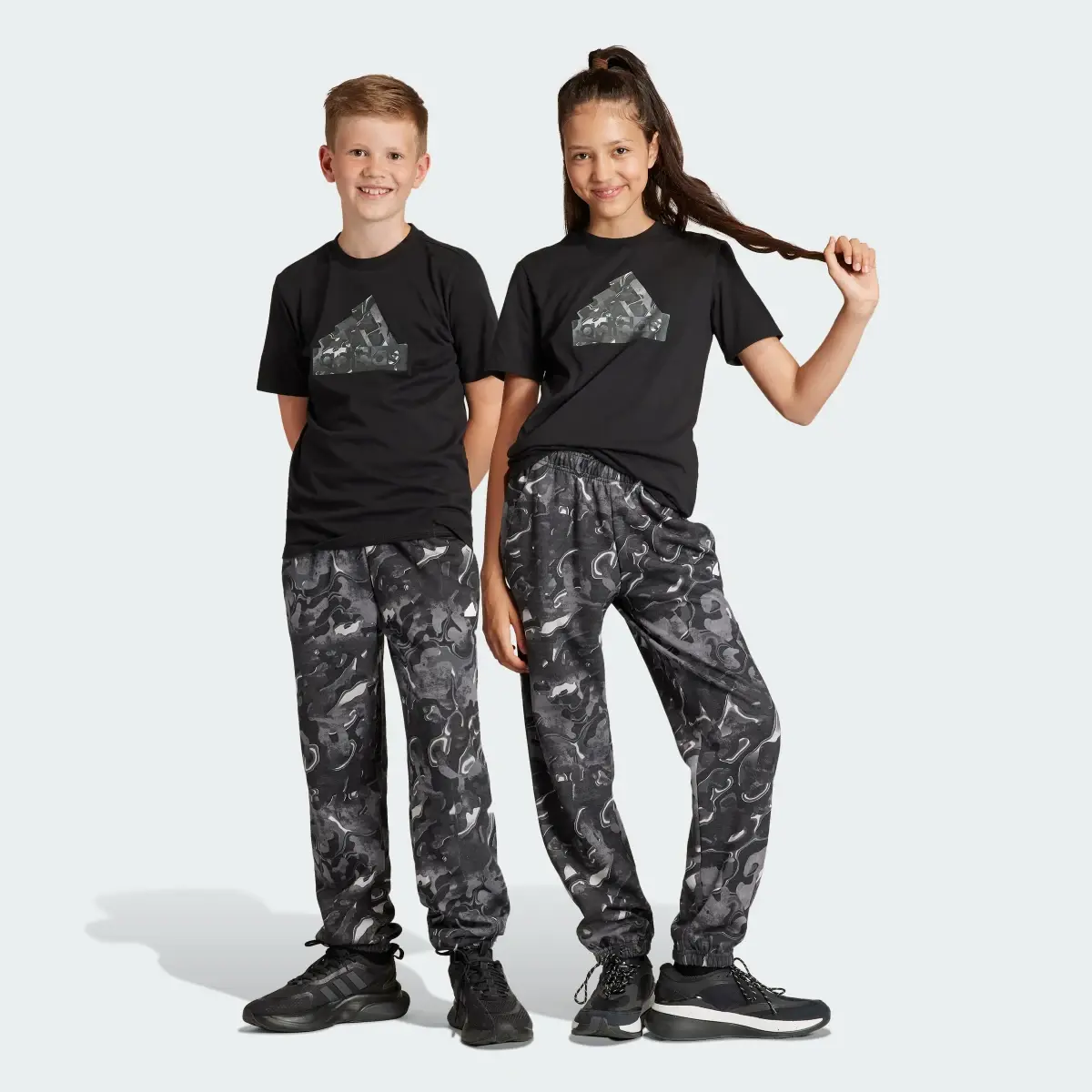 Adidas Future Icons Allover Print Joggers Kids. 1