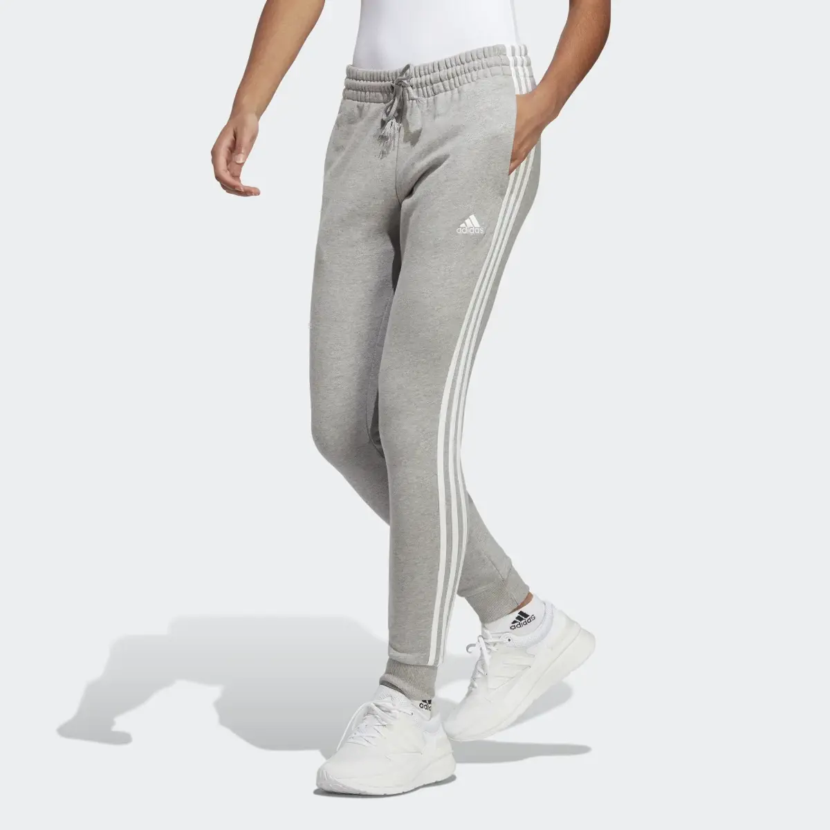 Adidas Essentials 3-Stripes French Terry Cuffed Joggers. 1