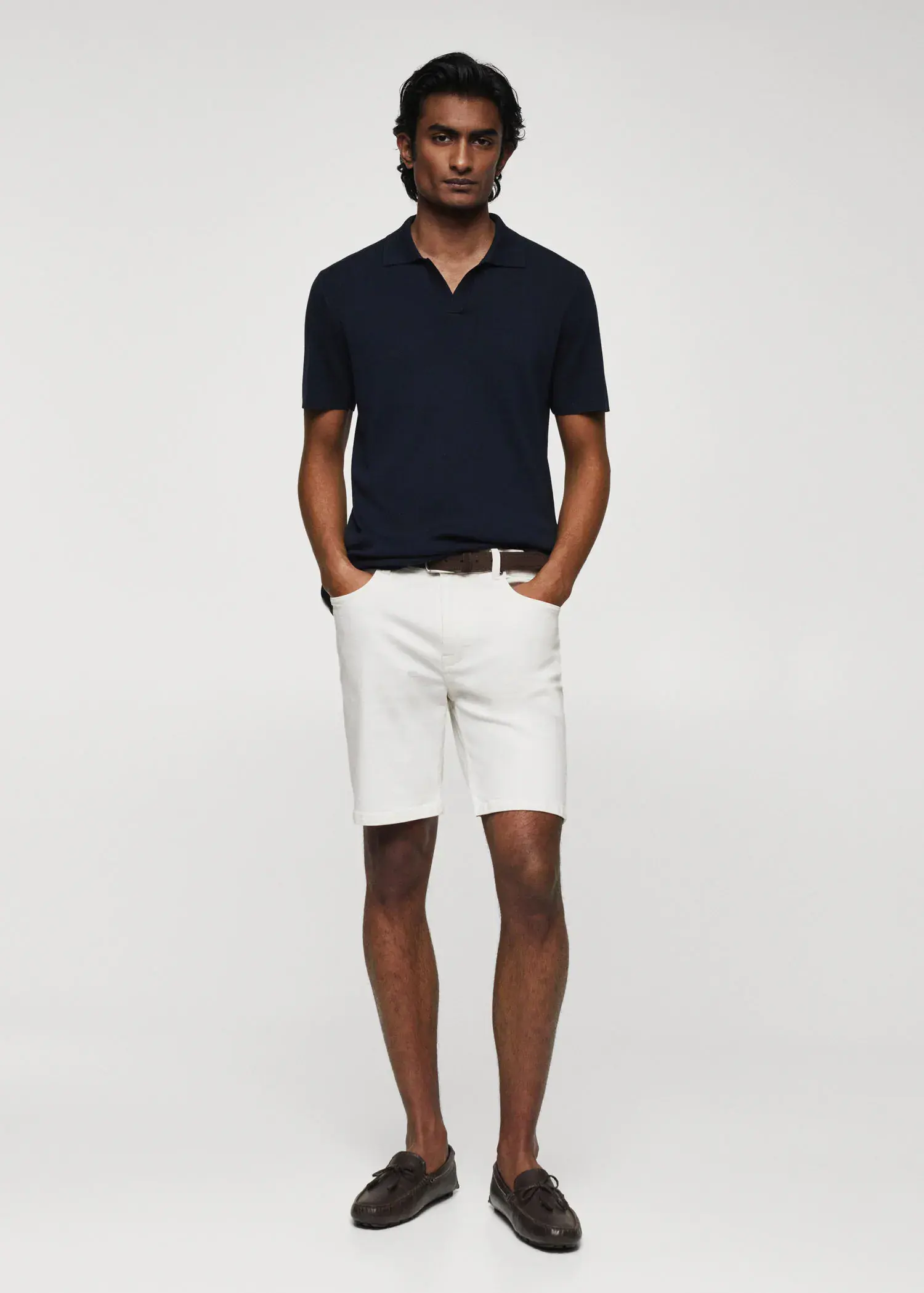 Mango Fine-knit polo shirt. a man wearing white shorts and a polo shirt. 