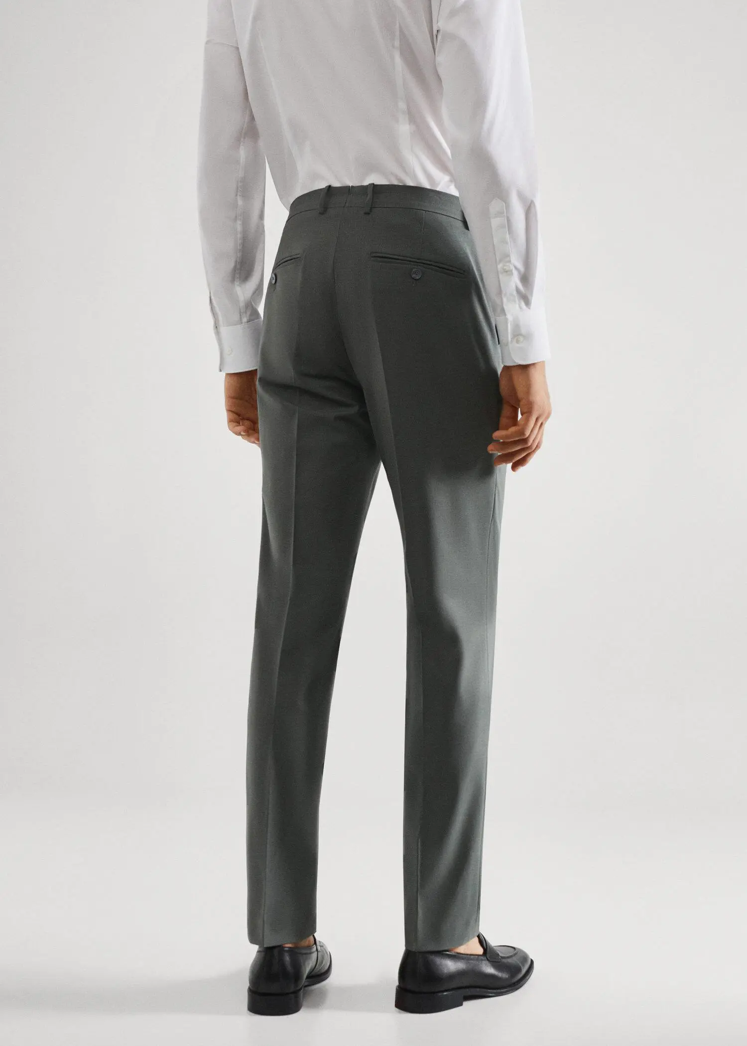 Mango Wool slim-fit suit trousers. a man in a white shirt and a gray suit. 