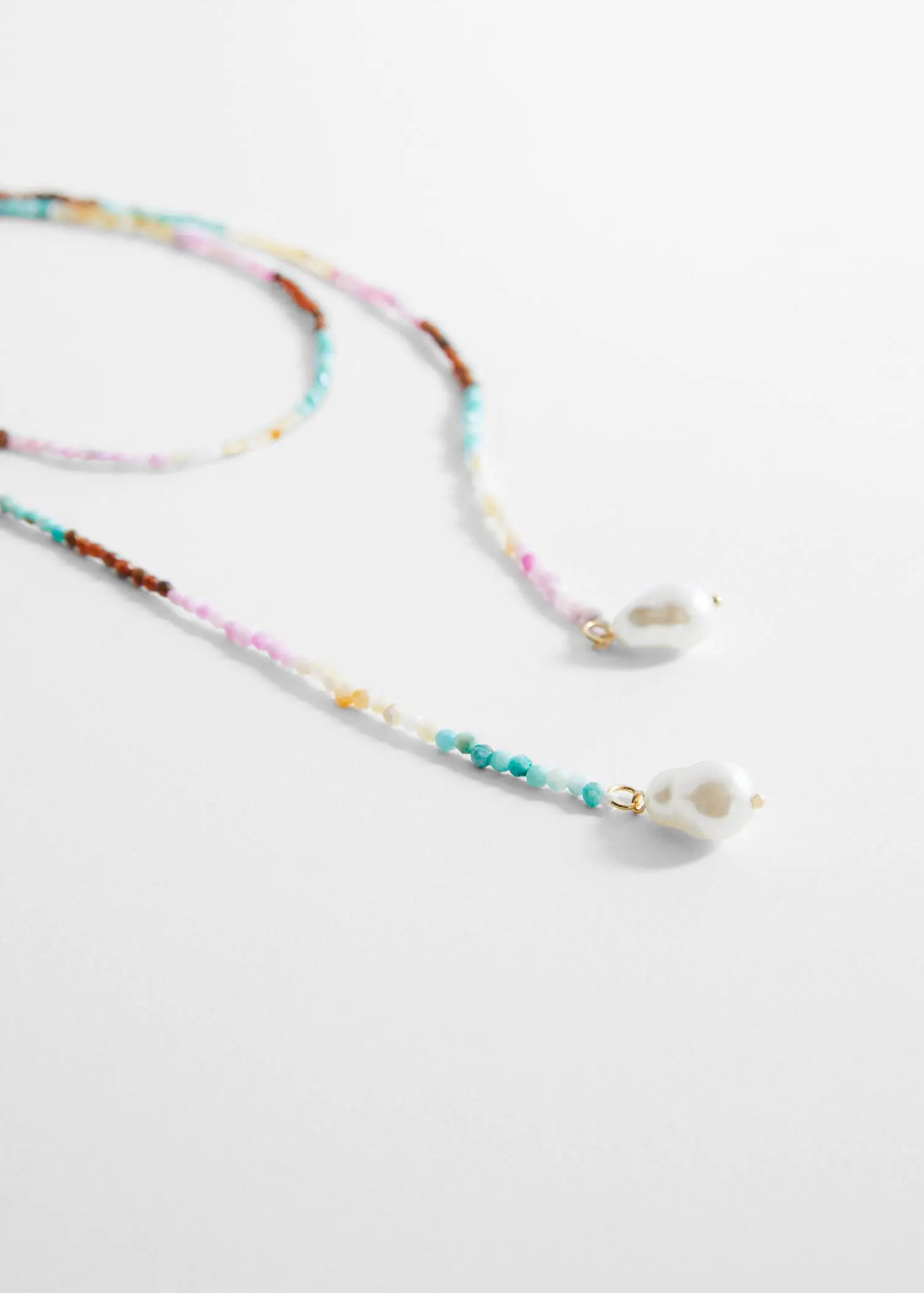 Mango Mixed bead necklace. a pair of colorful beaded eyeglass chains with a white bead. 