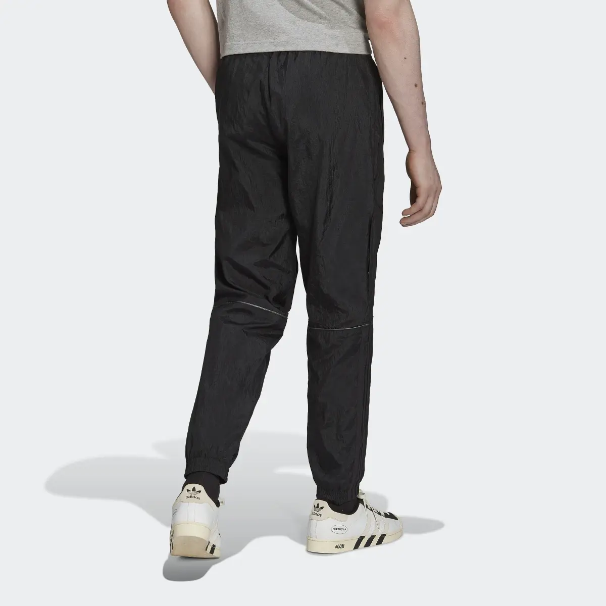 Adidas Pantalon de survêtement mix de matières Reveal. 2