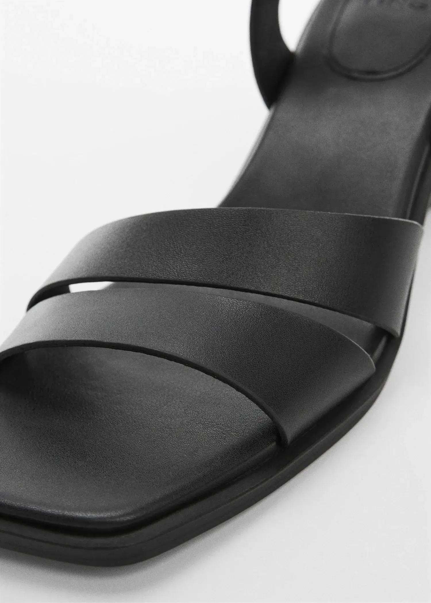 Mango Block-heel sandals. a close-up view of a pair of black sandals. 