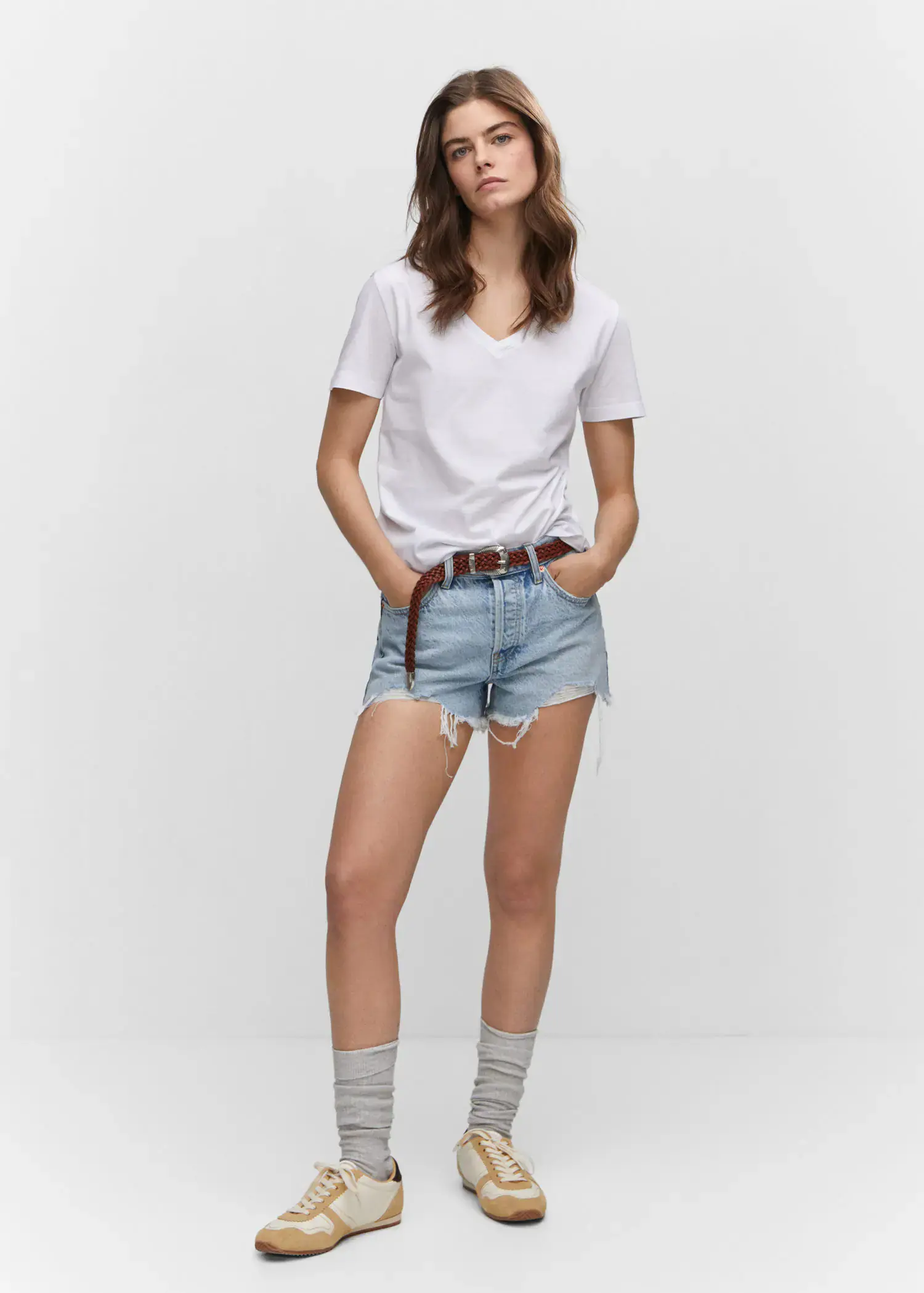 Mango V-neck cotton T-shirt. a woman in white shirt and jeans shorts. 