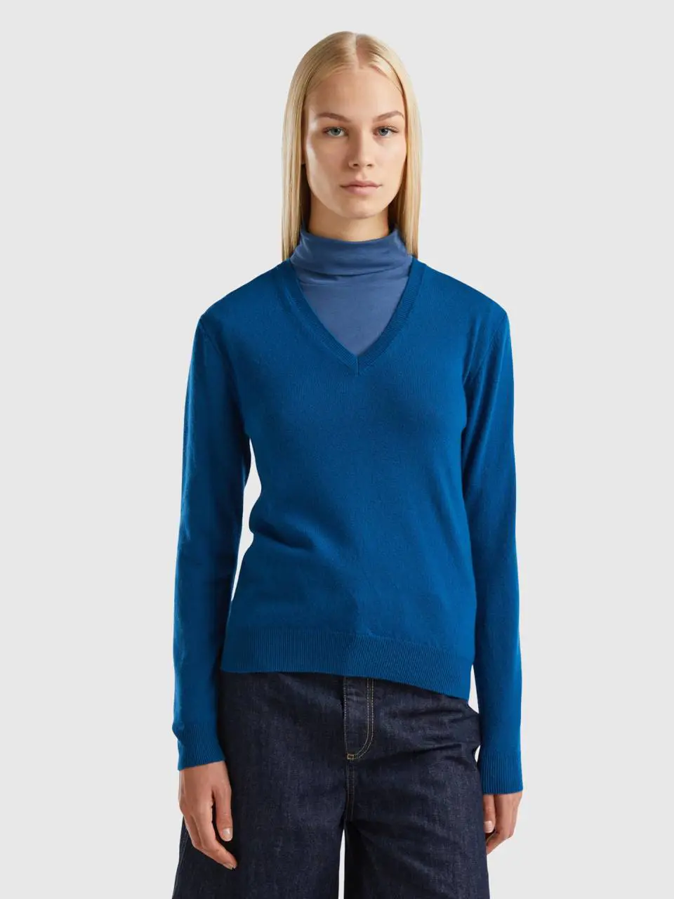 Benetton blue v-neck sweater in pure merino wool. 1