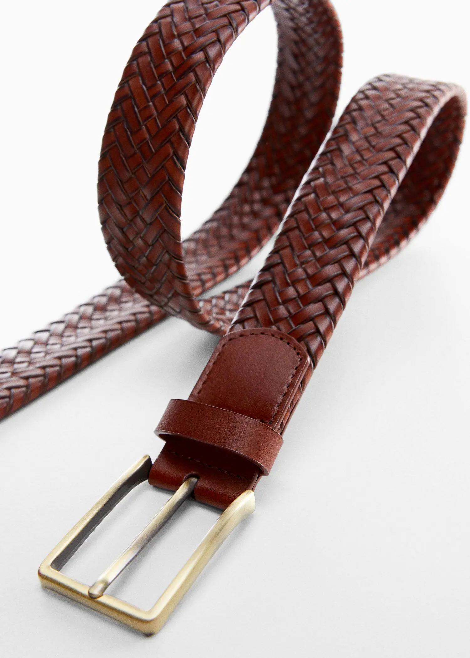 Mango Braided leather belt. a close-up of a brown leather belt. 