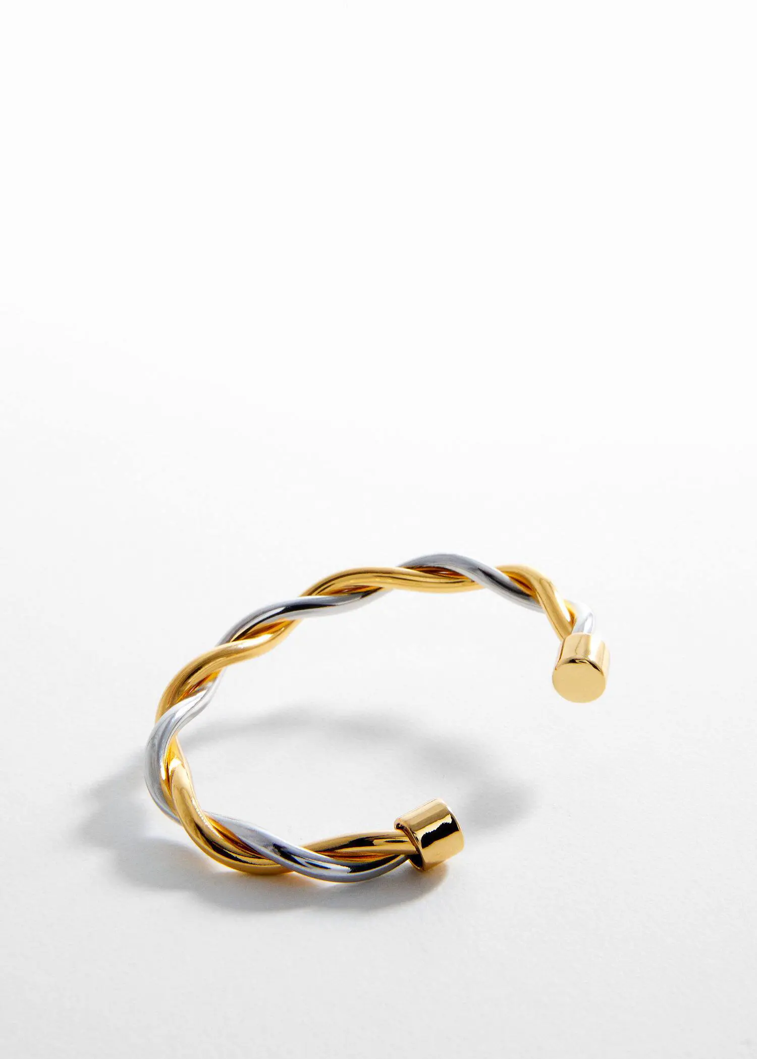Mango Rigid interlocking bracelet. a close up of a bracelet on a white surface 