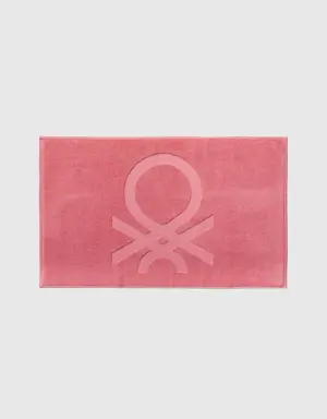 pink bathroom rug with logo