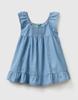 dress in chambray with flounce