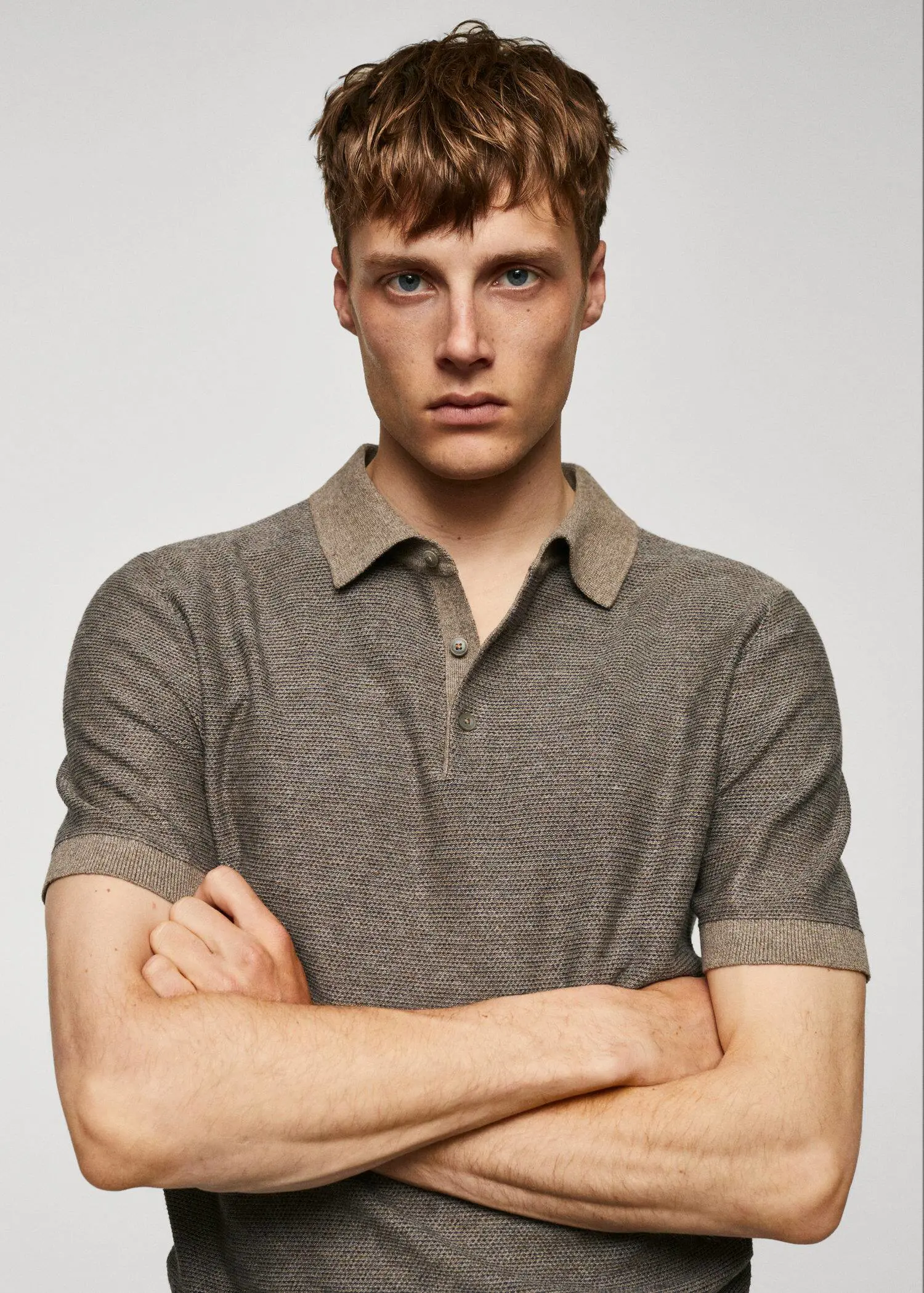 Mango Patterned cotton polo shirt. a man with his arms crossed wearing a polo shirt. 