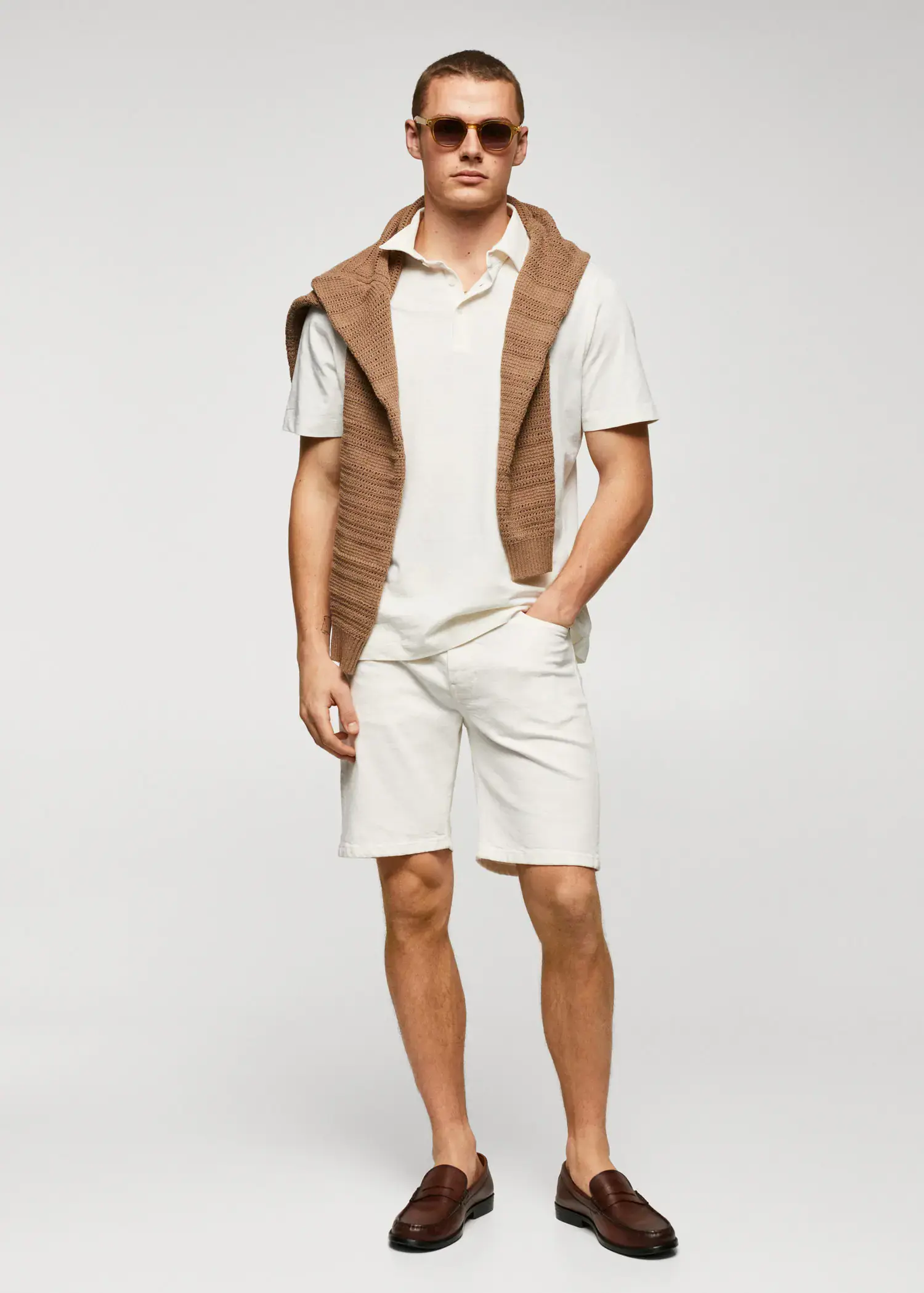 Mango 100% cotton basic polo shirt . a young man wearing a white shirt and shorts. 