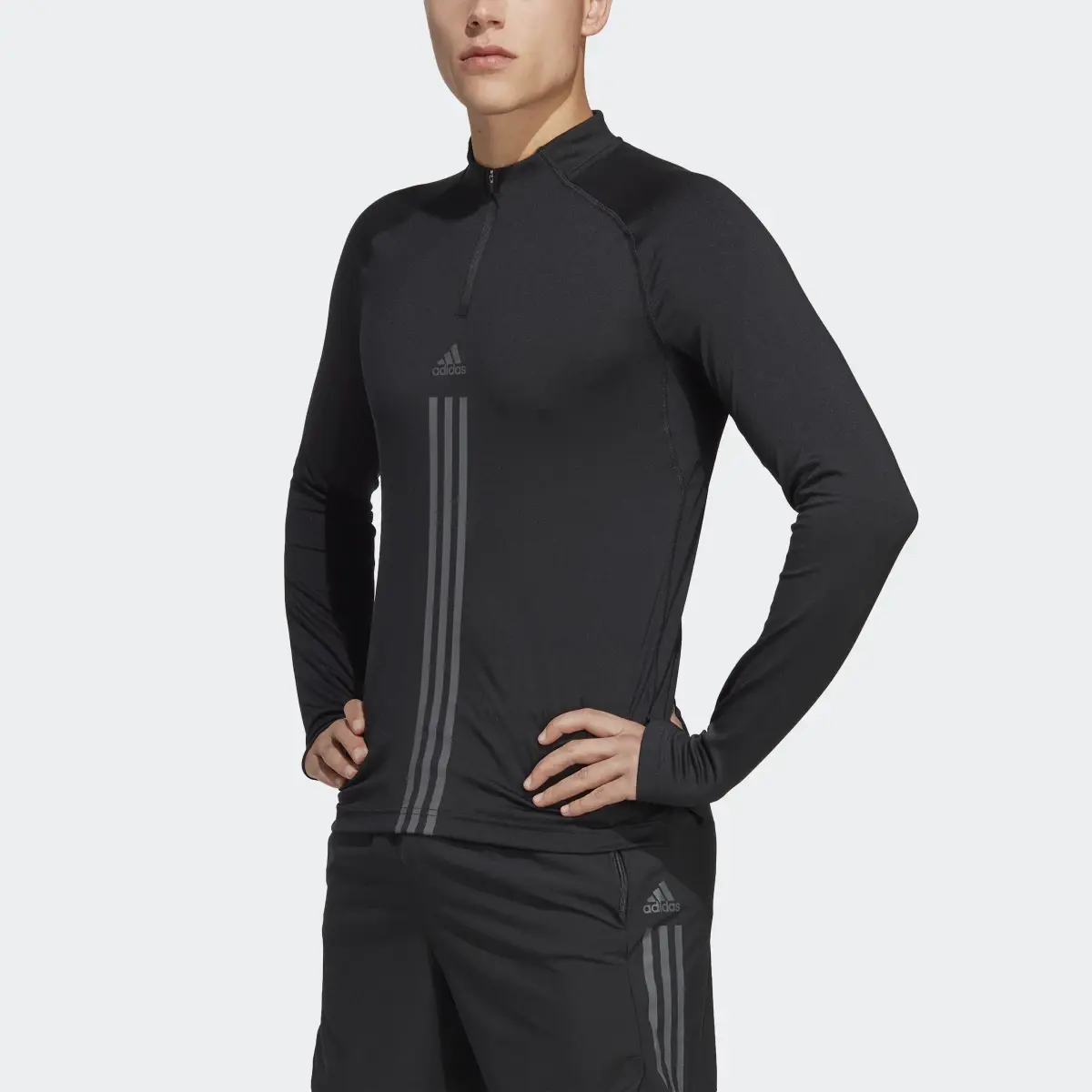 Adidas AlphaStrength 1/4 Zip Long Sleeve Top. 1