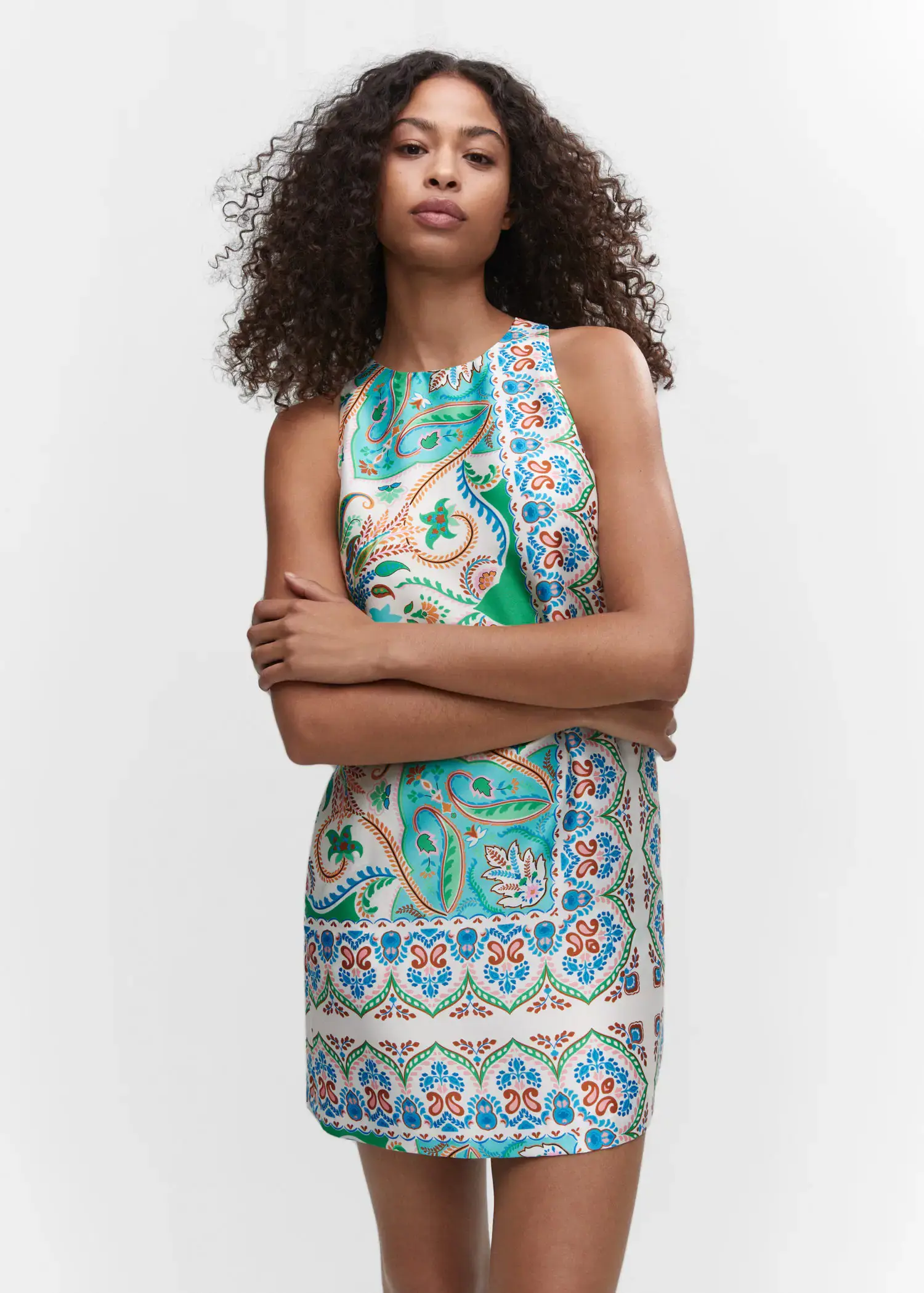 Mango Paisley-print satin dress. a woman standing in front of a white wall. 