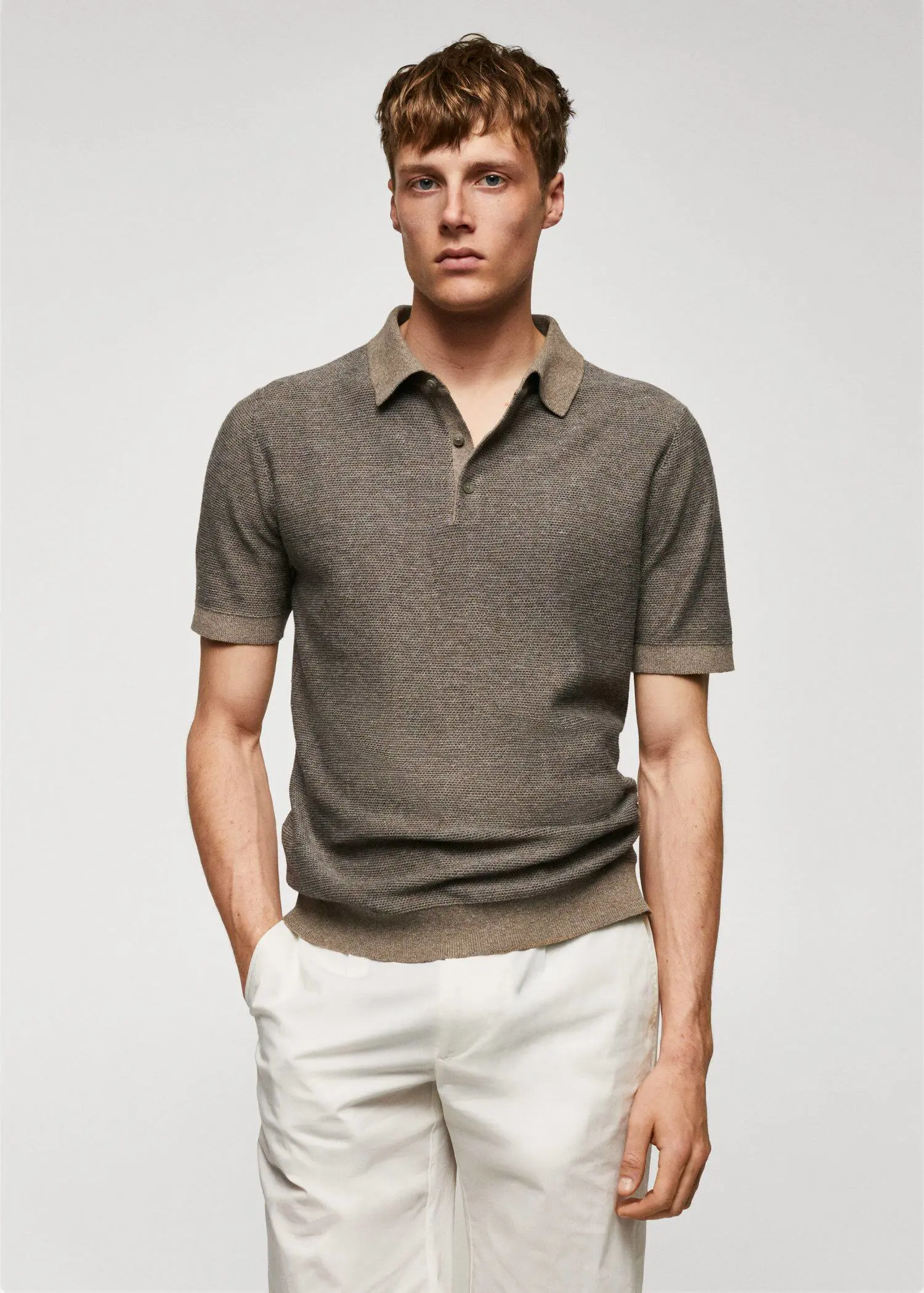 Mango Patterned cotton polo shirt. a man in a brown polo shirt and white pants. 