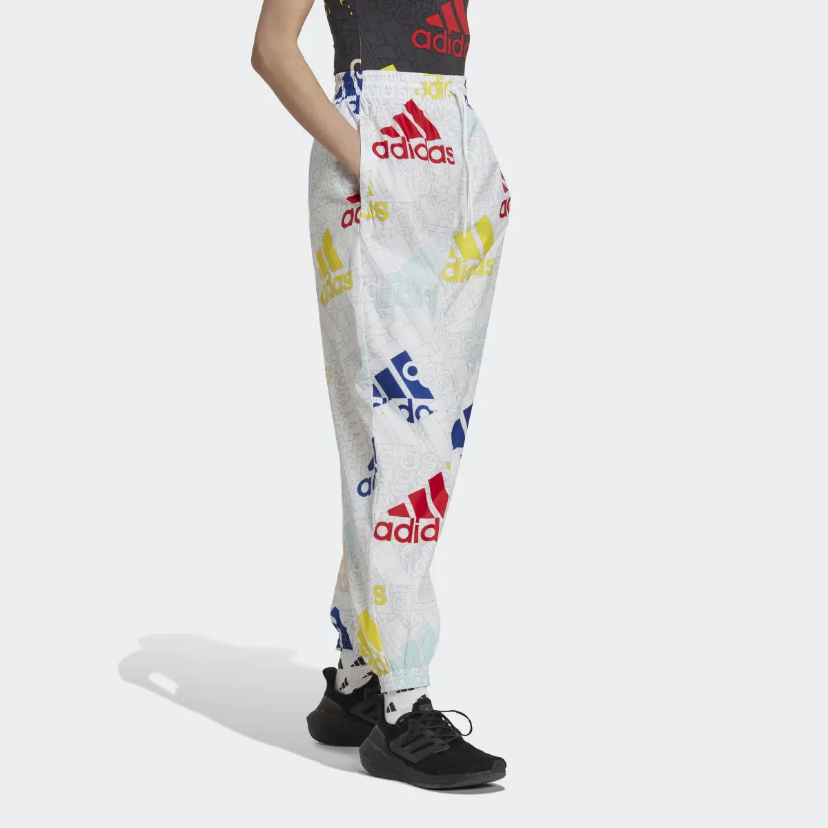 Adidas Essentials Multi-Colored Logo Loose Fit Woven Pants. 3