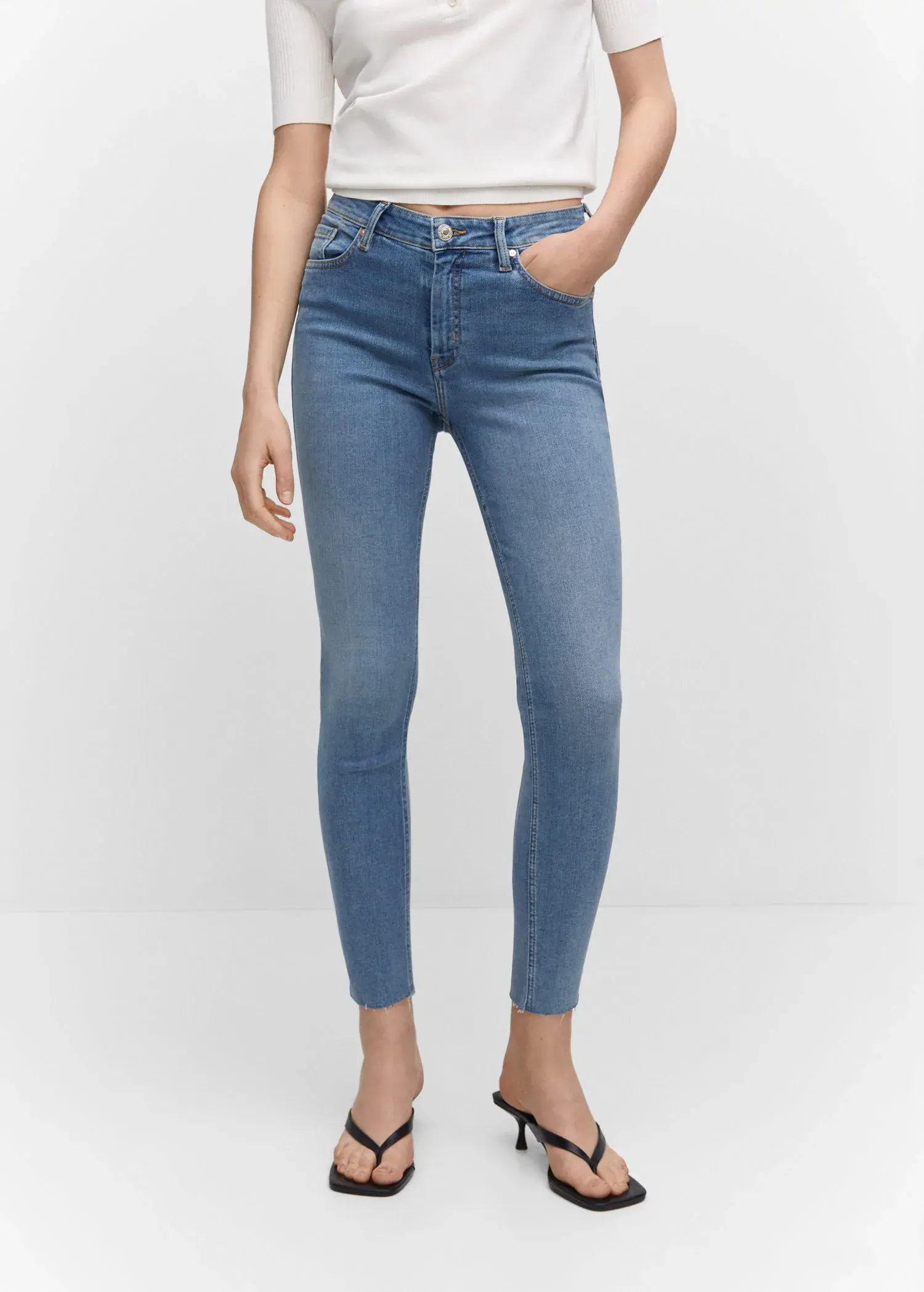 Mango Skinny cropped jeans. a pair of women's jeans are shown in front. 