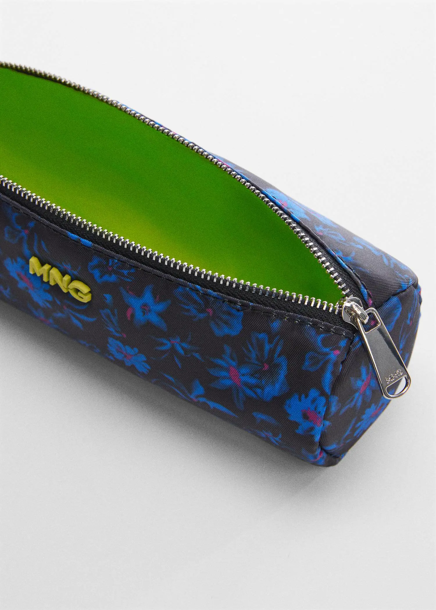 Mango Logo zipped pencil case. a close-up view of the inside of a pencil case. 
