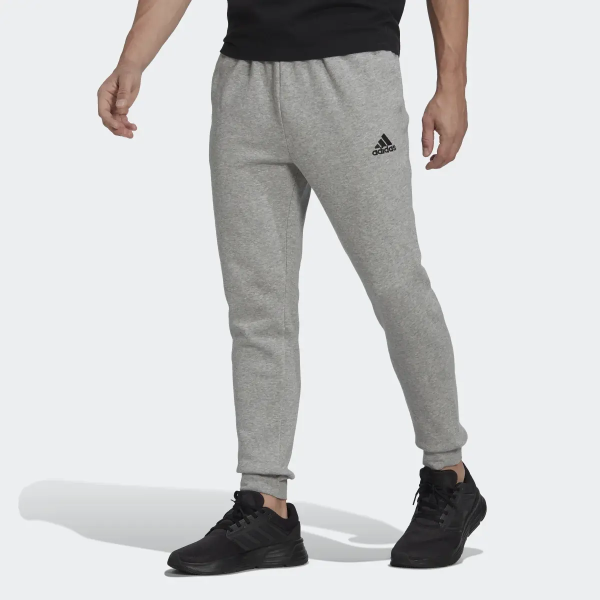 Adidas Essentials Fleece Regular Tapered Hose. 1