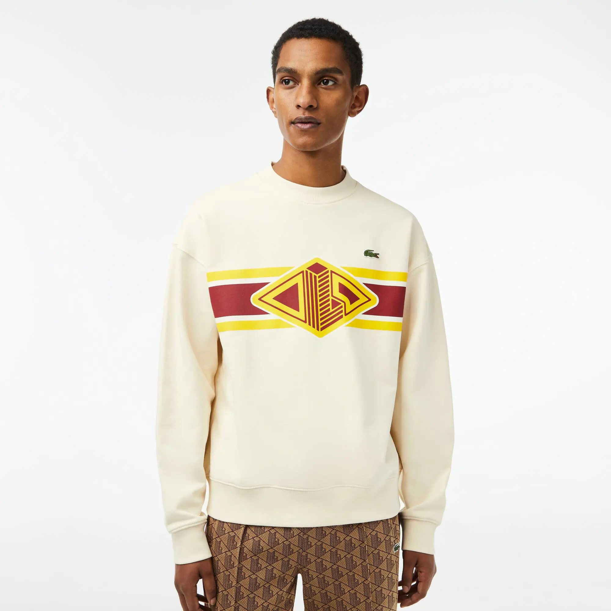 Lacoste Men’s Lacoste Round Neck Loose Fit Printed Sweatshirt. 1