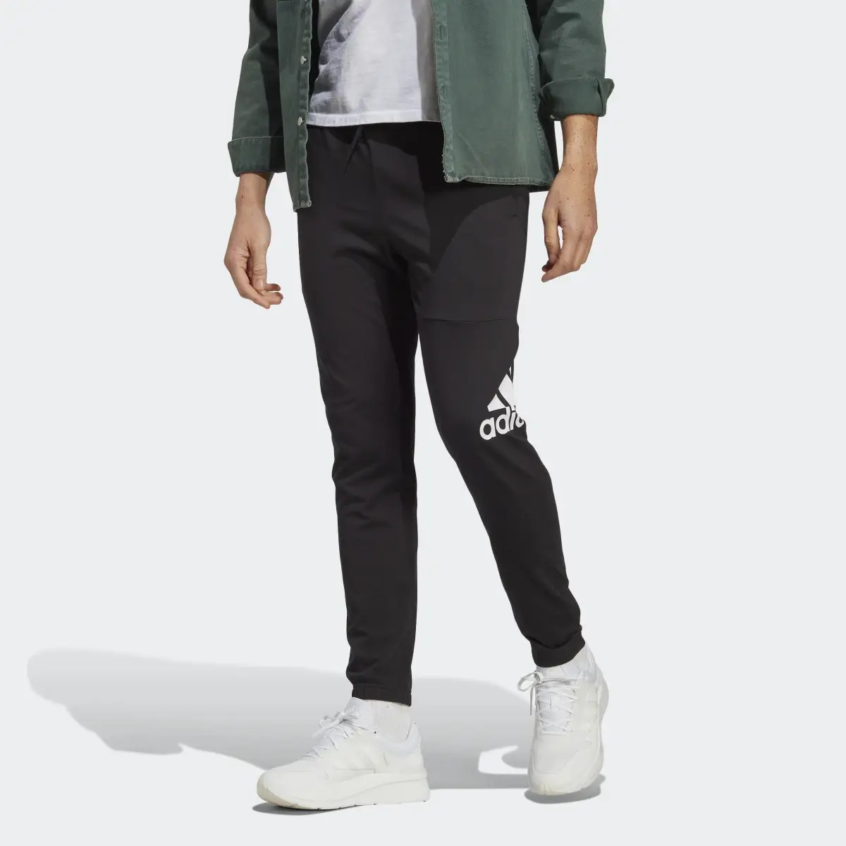 Adidas Essentials Single Jersey Tapered Badge of Sport Pants. 1
