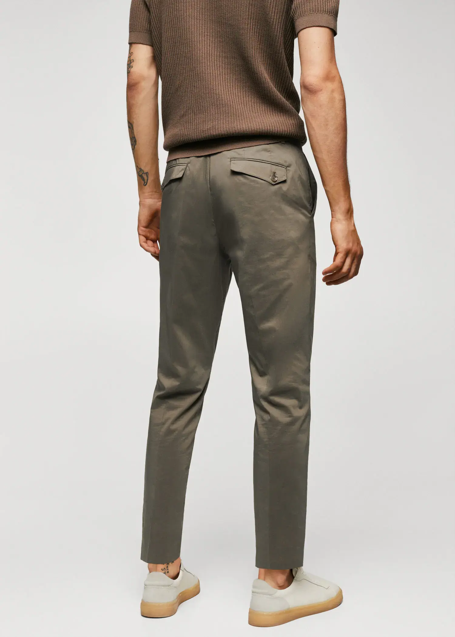 Mango Lightweight cotton trousers. a man wearing a brown shirt and a pair of brown pants. 