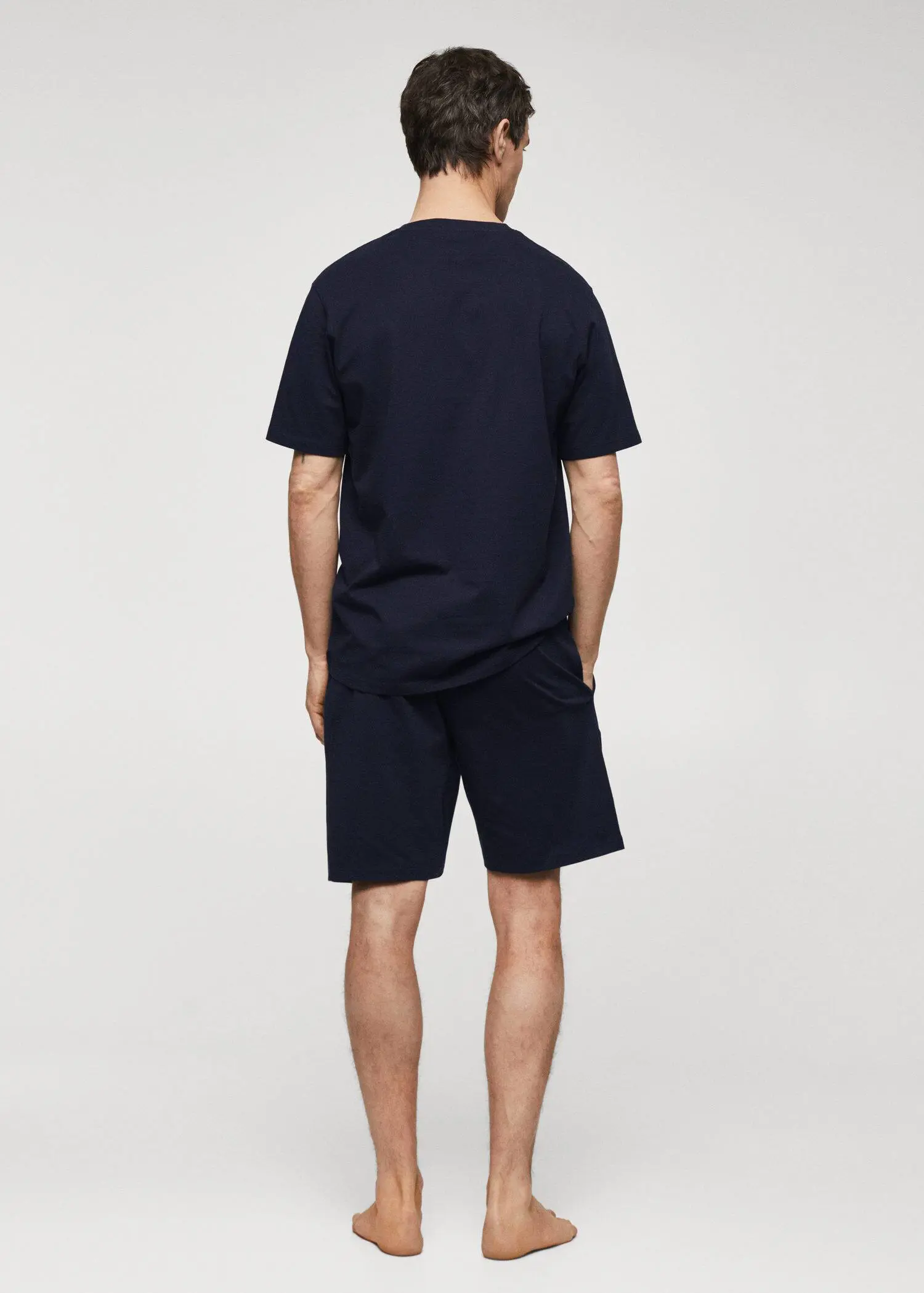 Mango Cotton pyjama shorts pack. a man wearing a black shirt and shorts. 